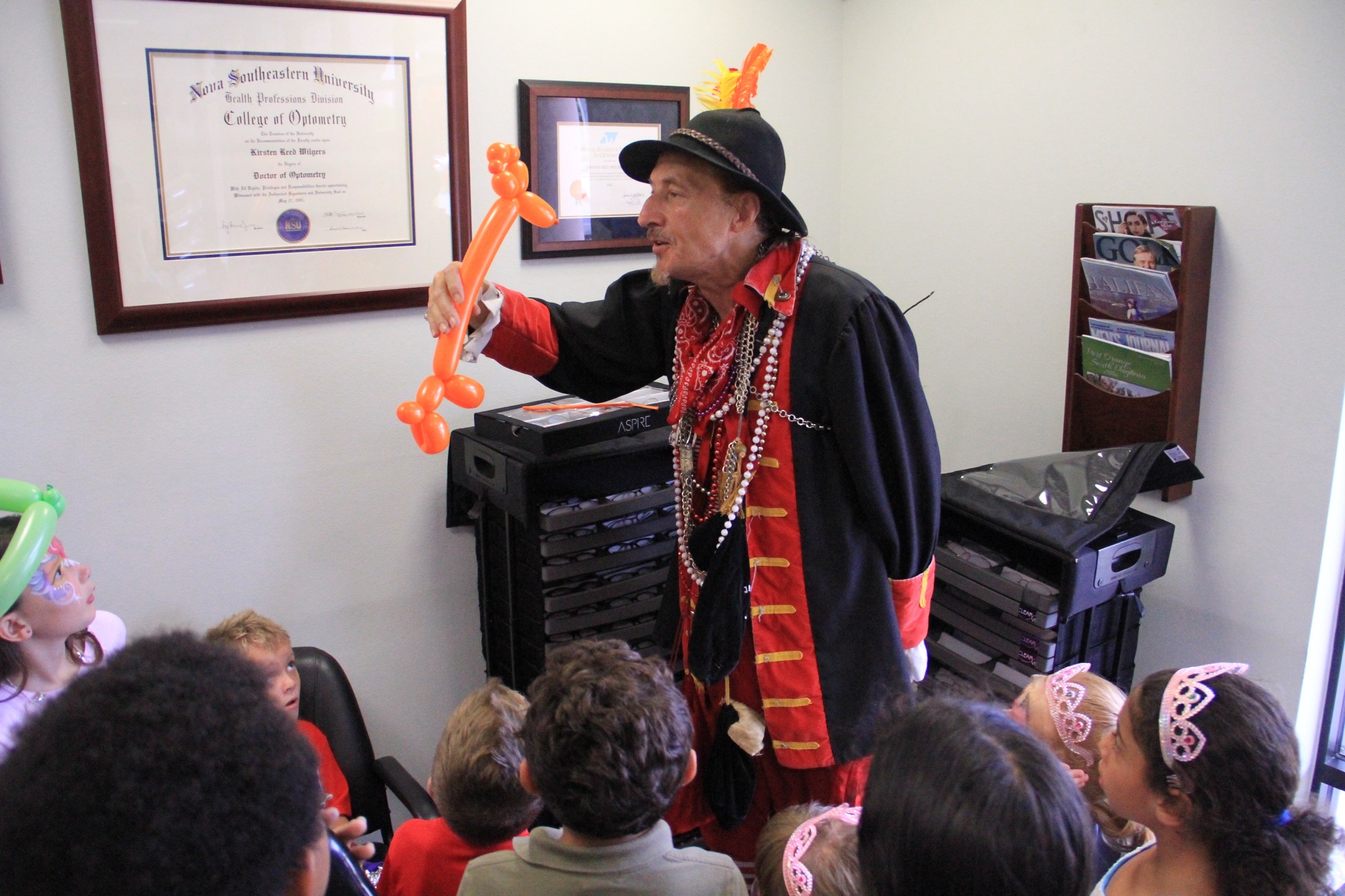 Magician William Franks performs for children during Kids' Day. Photo by Nichole Osinski.