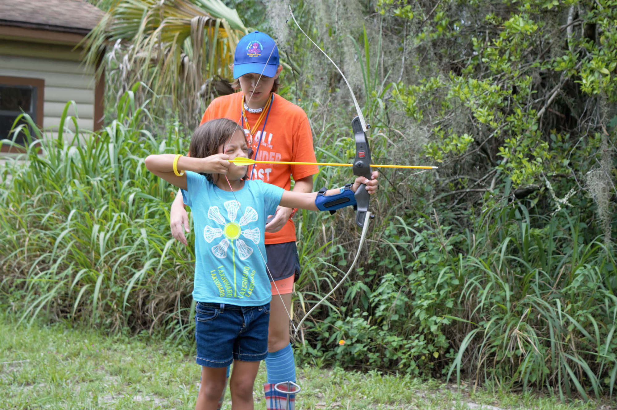 A Girl Scout learns archery. Photo courtesy of the Girl Scouts of Citrus Council