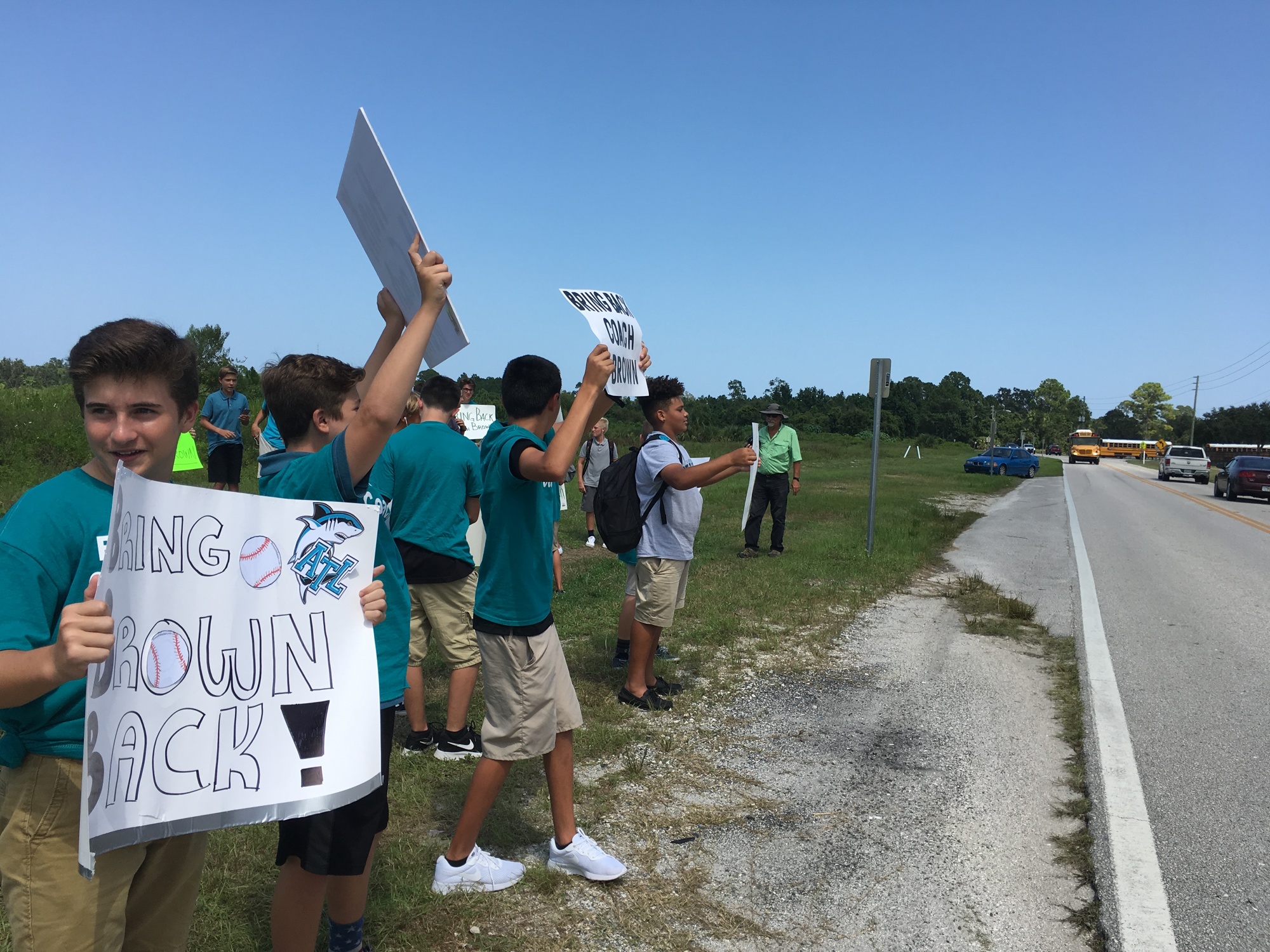 Students hold up signs in support of Benjamin Antwan Brown. Photo by Nichole Osinski