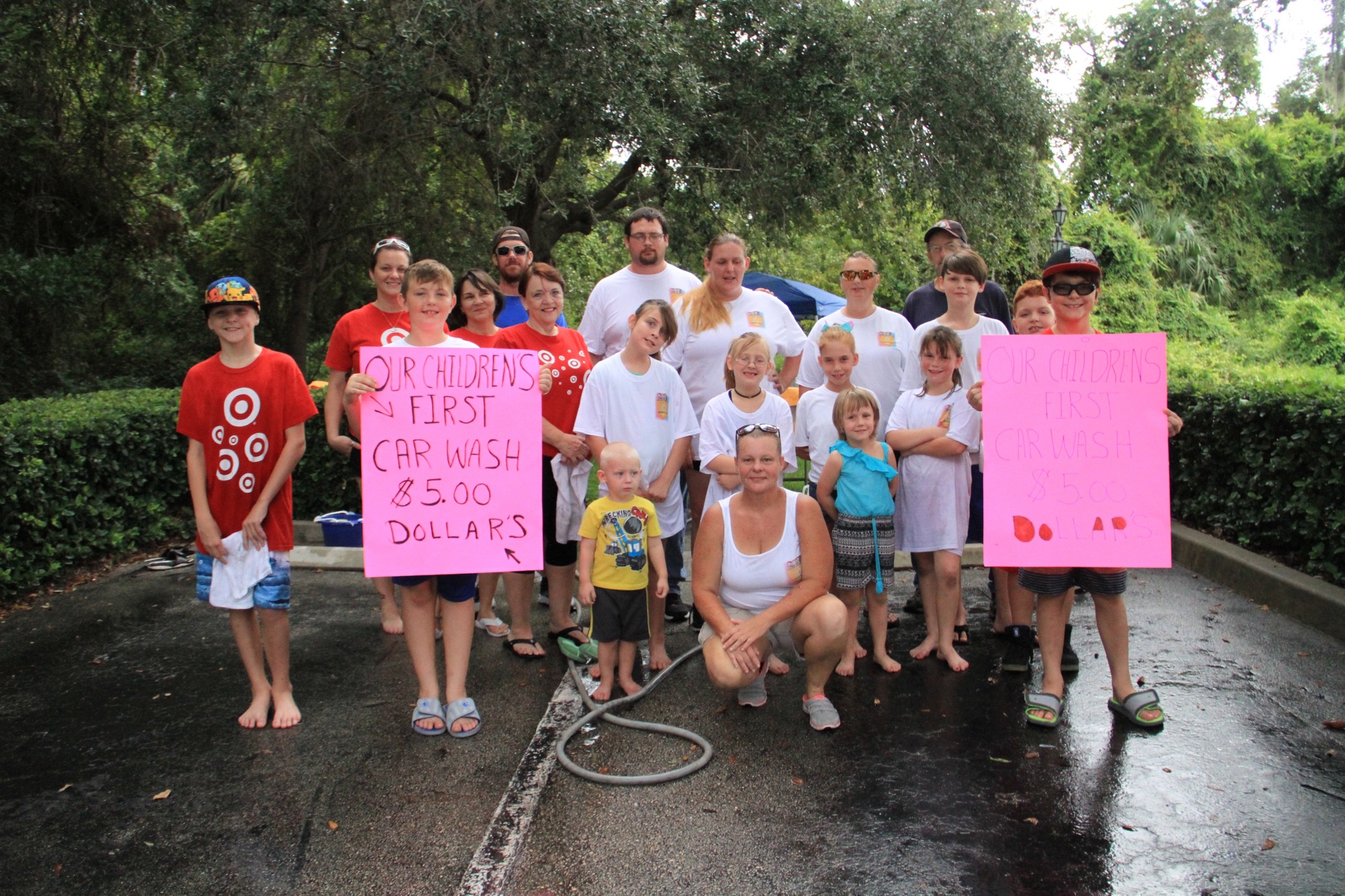 Volunteers at the Our Children First Foundation's car wash. Photo by Nichole Osinski