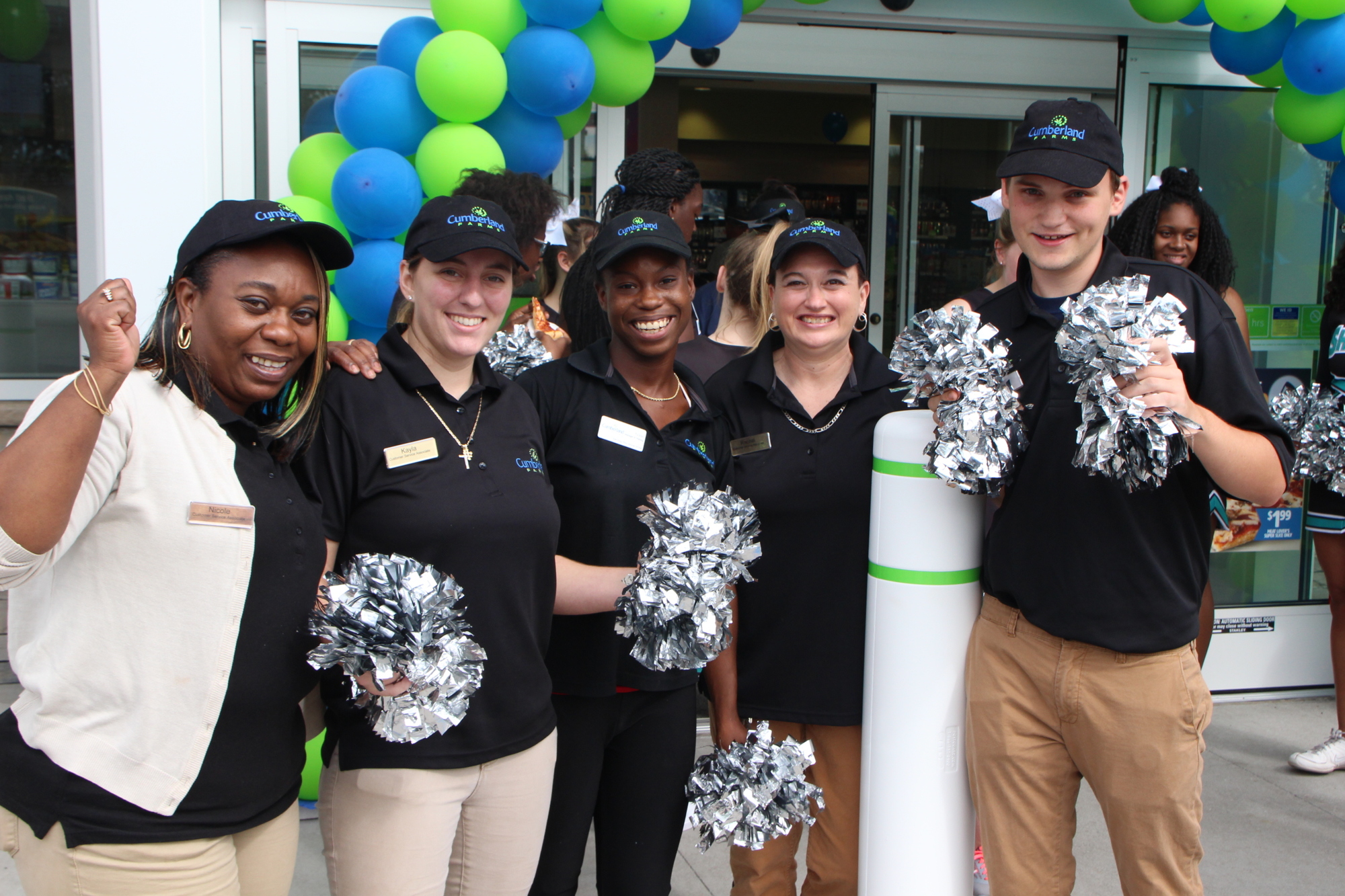 Cumberland Farms employees stand outside the new store. Photo courtesy of Cumberland Farms