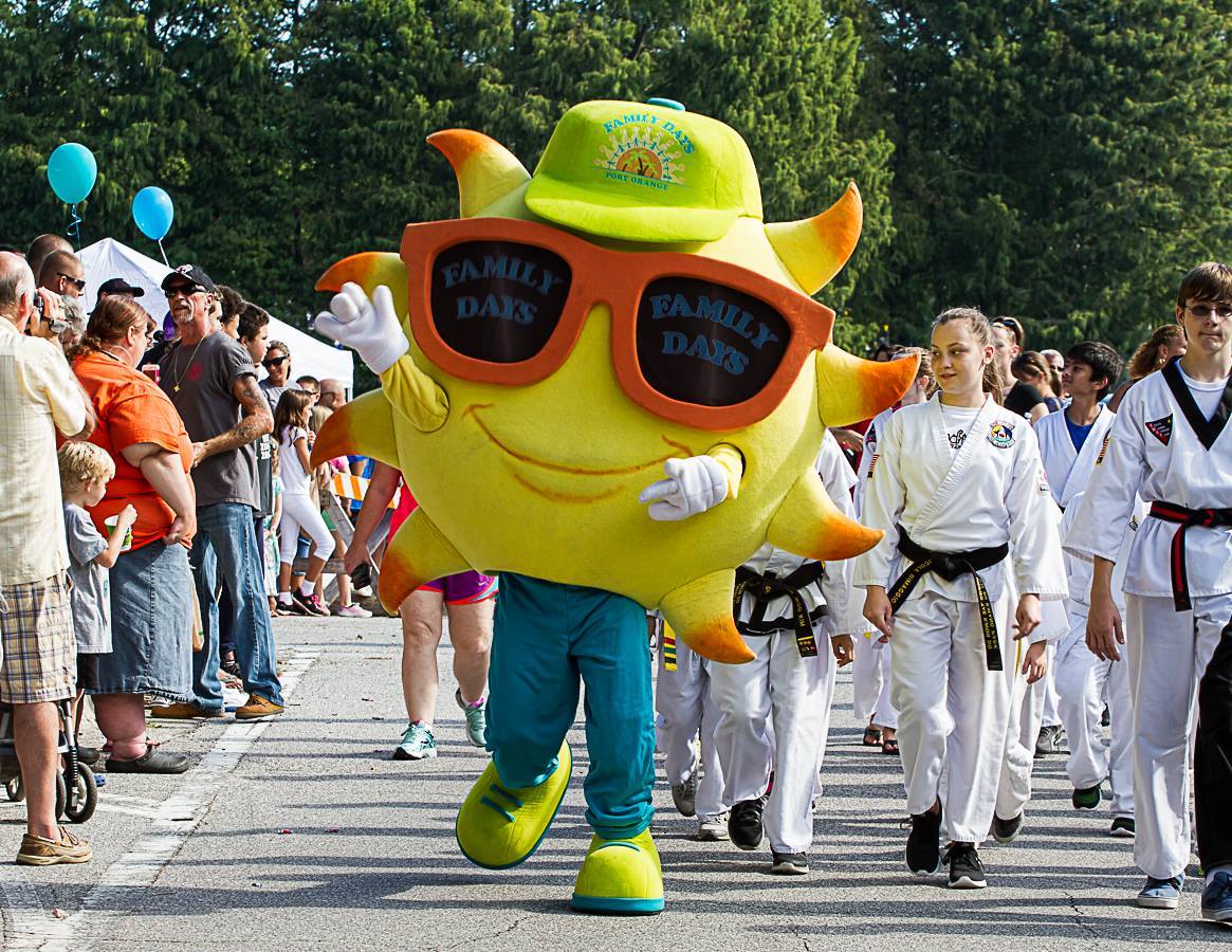 Residents watch as Shades the mascot  participates in the Family Days parade. Photo courtesy of Port Orange Community Trust