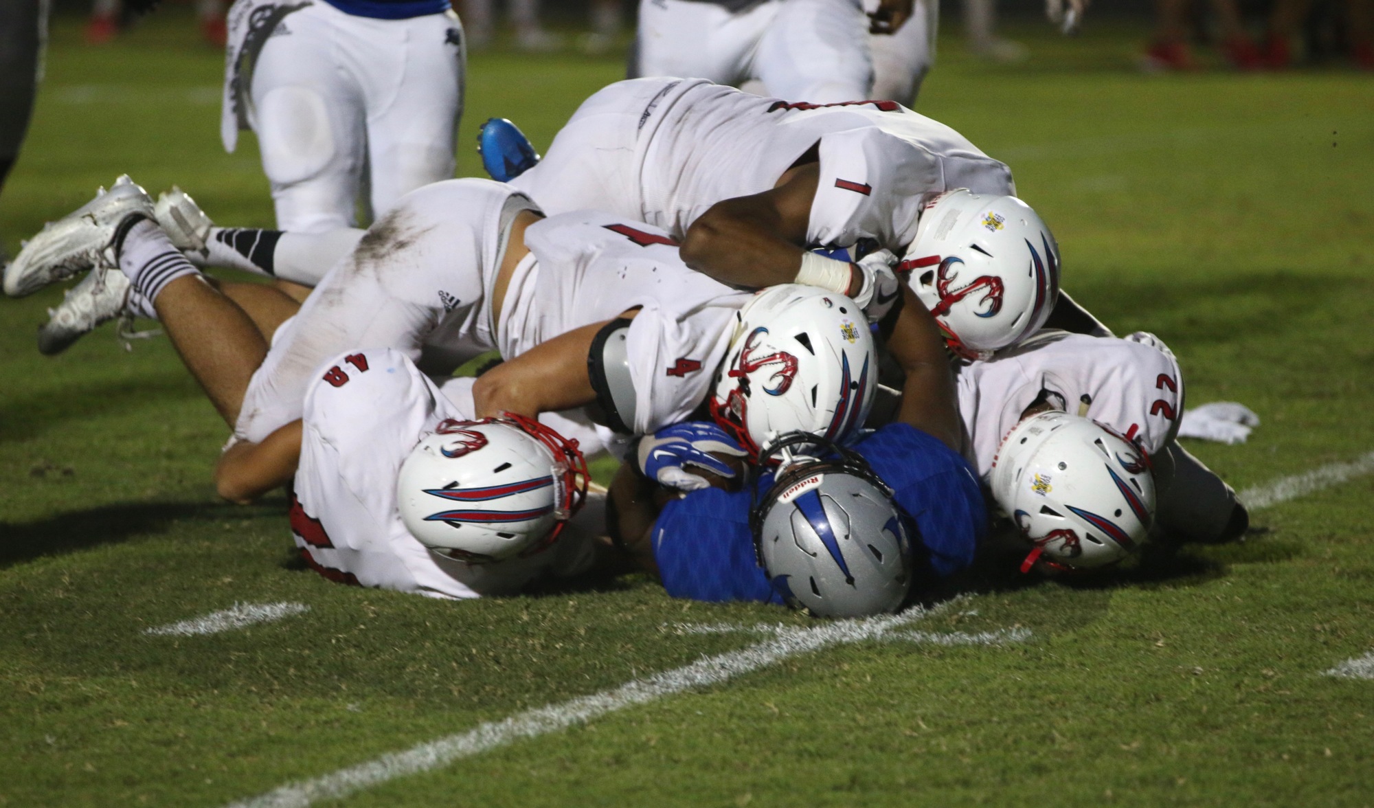 Matanzas running back Trenton Steward is tackled by a group of Seabreeze players. Photo by Ray Boone