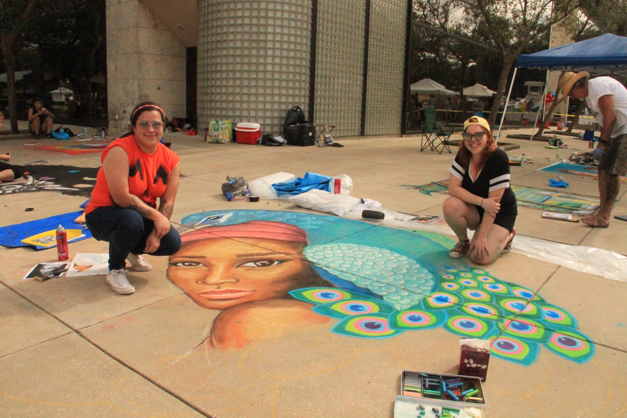 Kaylee Stewart and Sarah Beagan pose with their artwork. Photo by Nichole Osinski