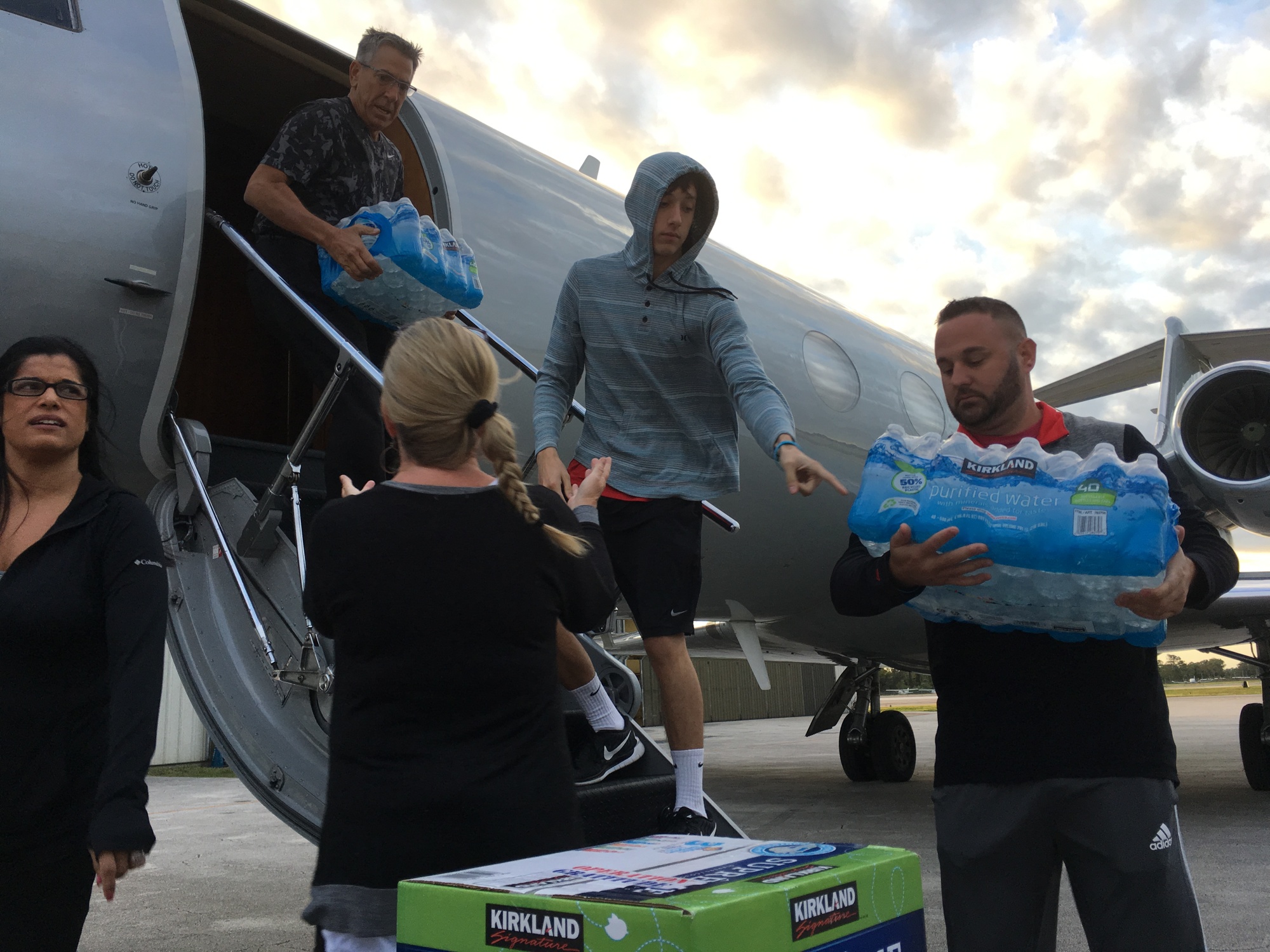 Donated goods are unloaded from the plane. Photo by Nichole Osinski