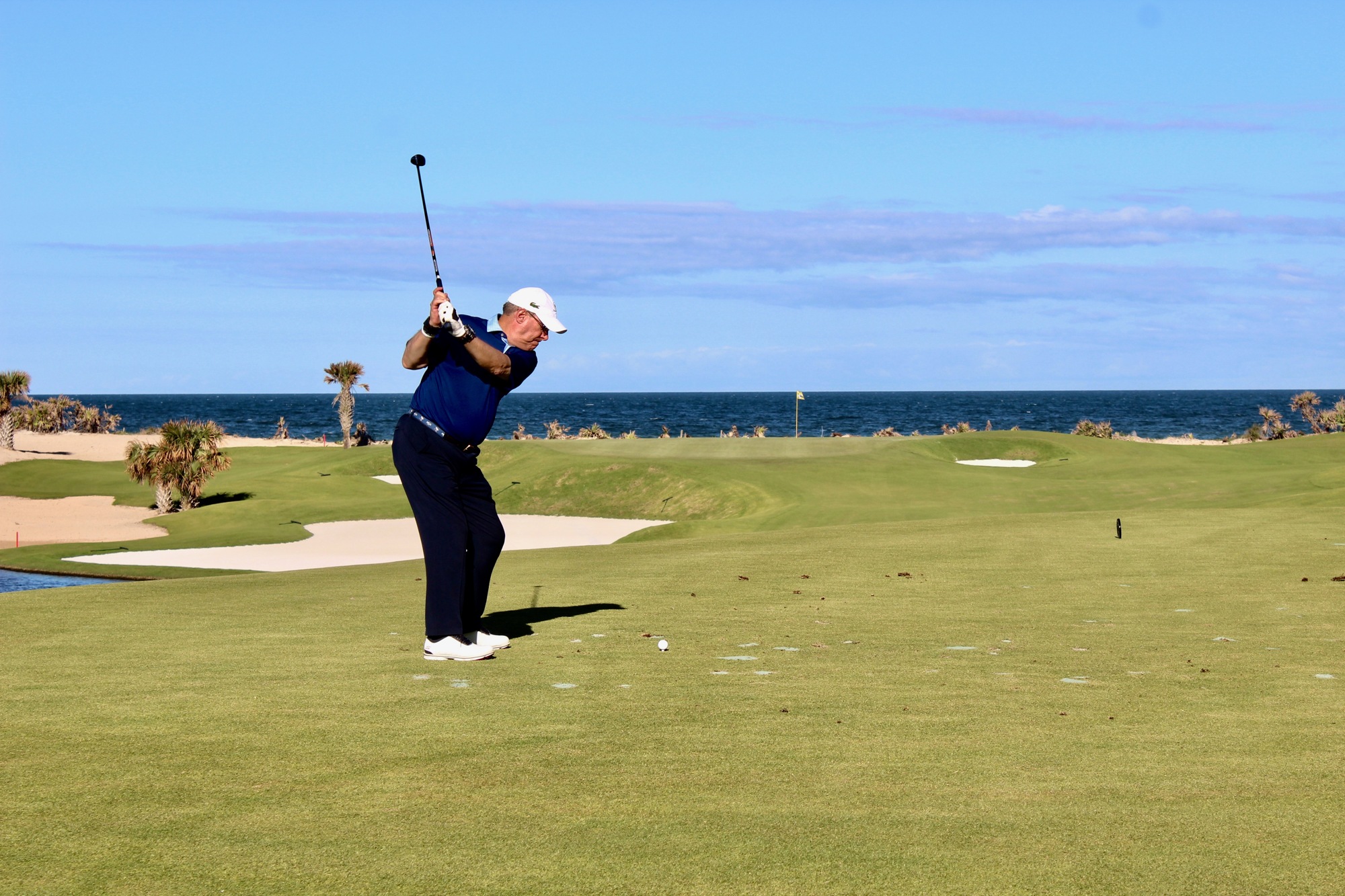 Les Schupak tees it up on the 17th hole at the Hammock Beach Resort's Ocean Course. Photo by Ray Boone