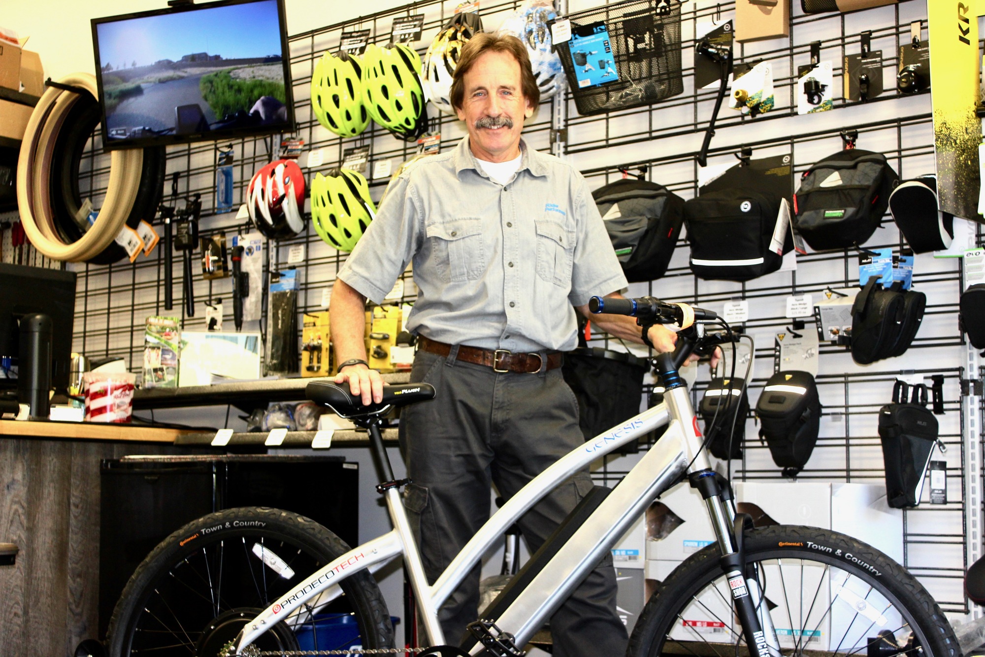 Mark Goettsch, the owner of Rider Performance Group, poses with an e-bike. Photo by Ray Boone