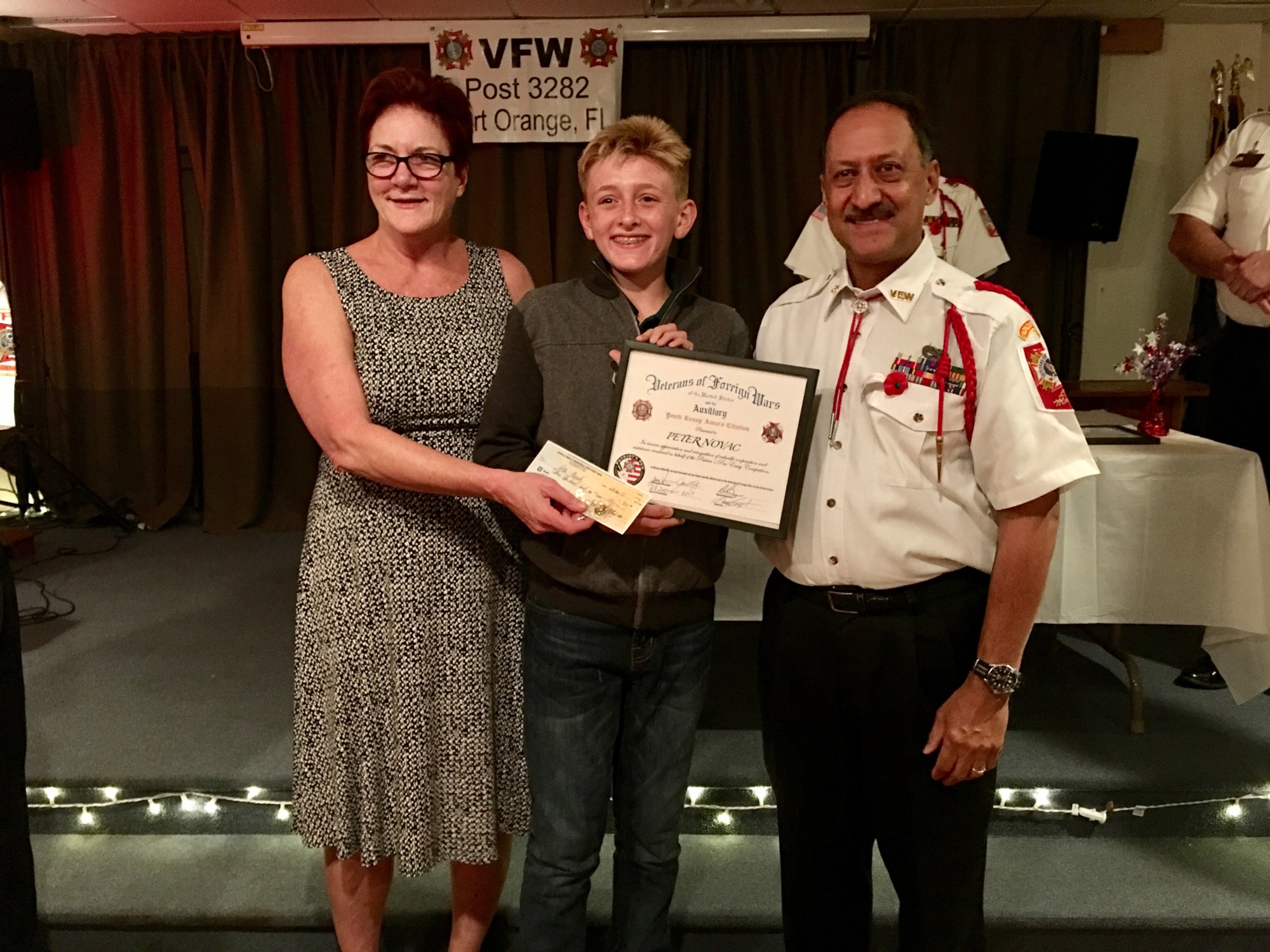 Jane Lilyander, president of the auxiliary, Peter Novak and Jose 