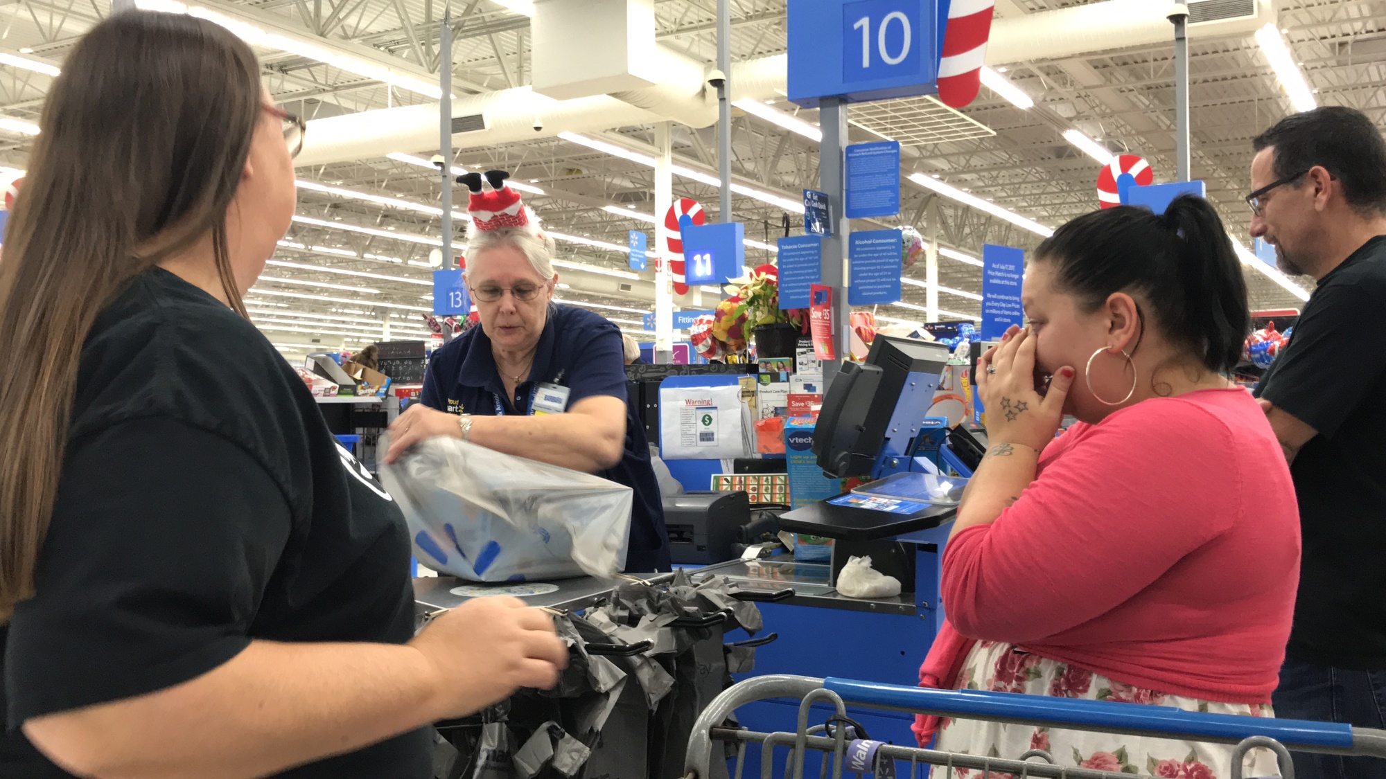 Maria Mills-Benat surprises a shopper at Walmart. Photo courtesy of Foundation 37