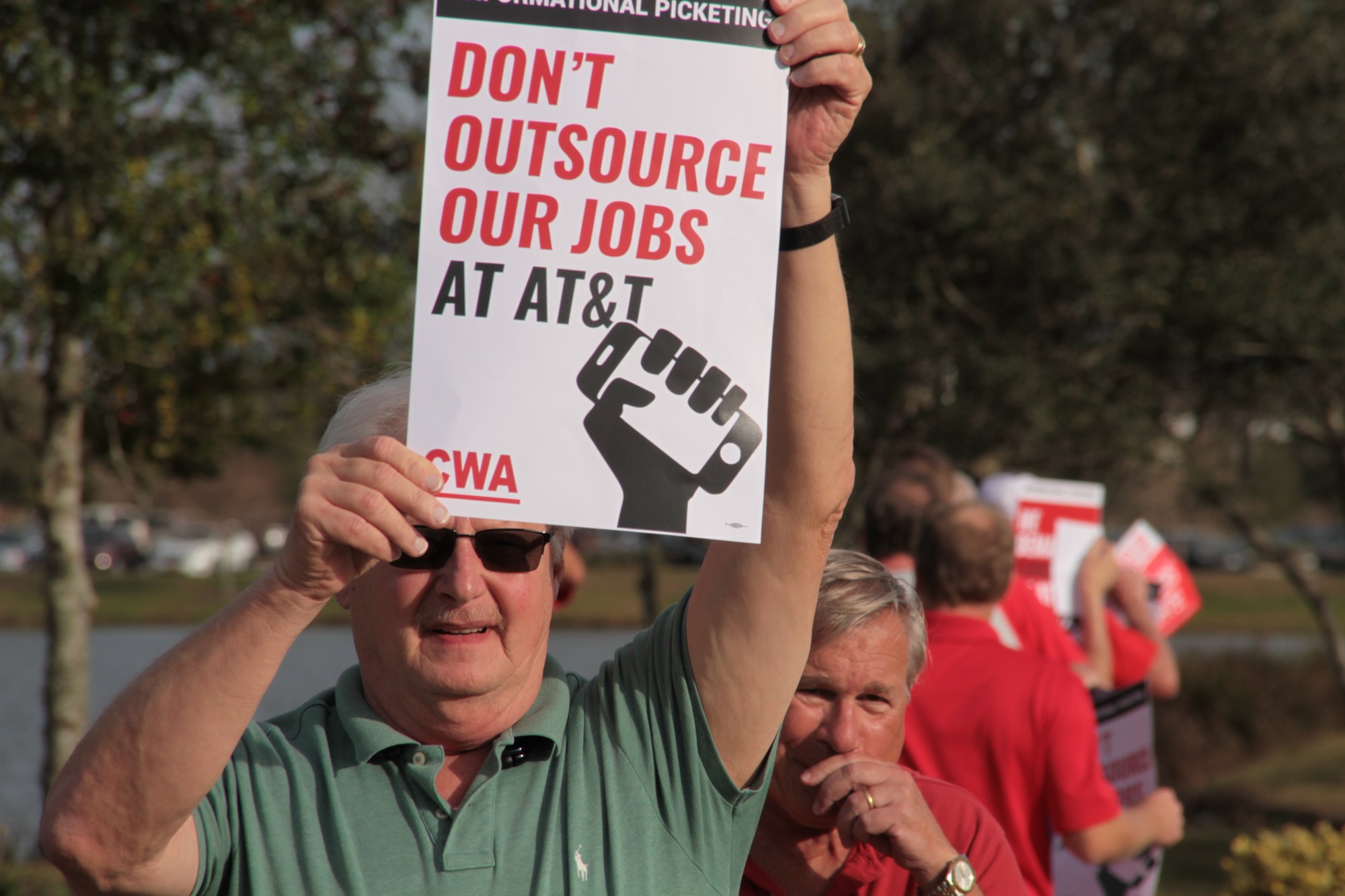 AT&T communications workers and union members protested at The Pavilion on Friday, Feb. 9. Photo by Nichole Osinski