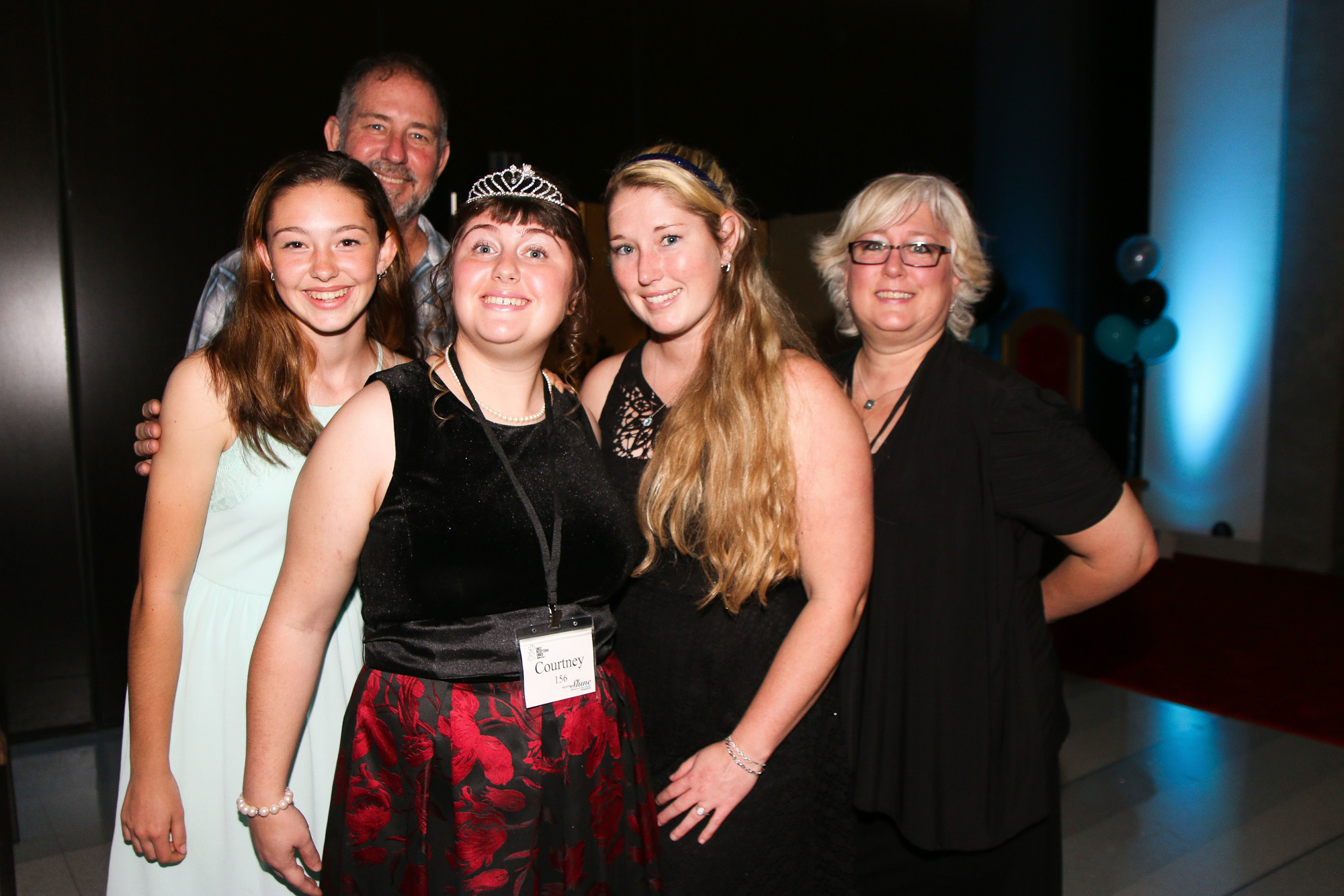 Port Orange residents Trinity, Byron, Courtney, Katie and Anne Widdison celebrate at Courtney's second Night to Shine. Photo by Paige Wilson