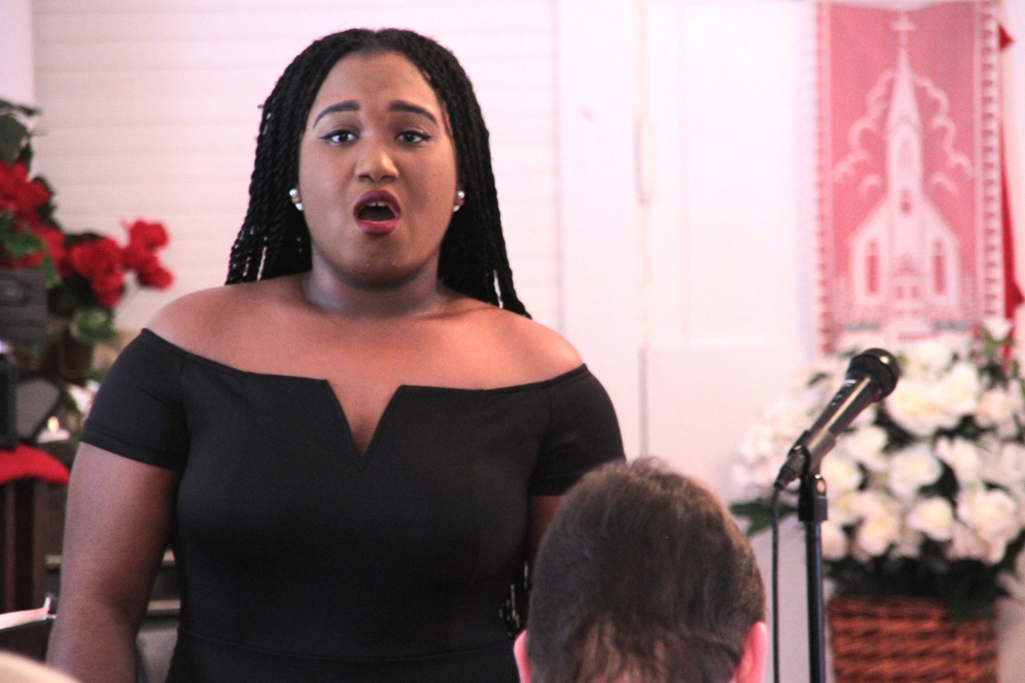 Ashia Barnes sings during the Freemanville Ceremony. Photo by Nichole Osinski