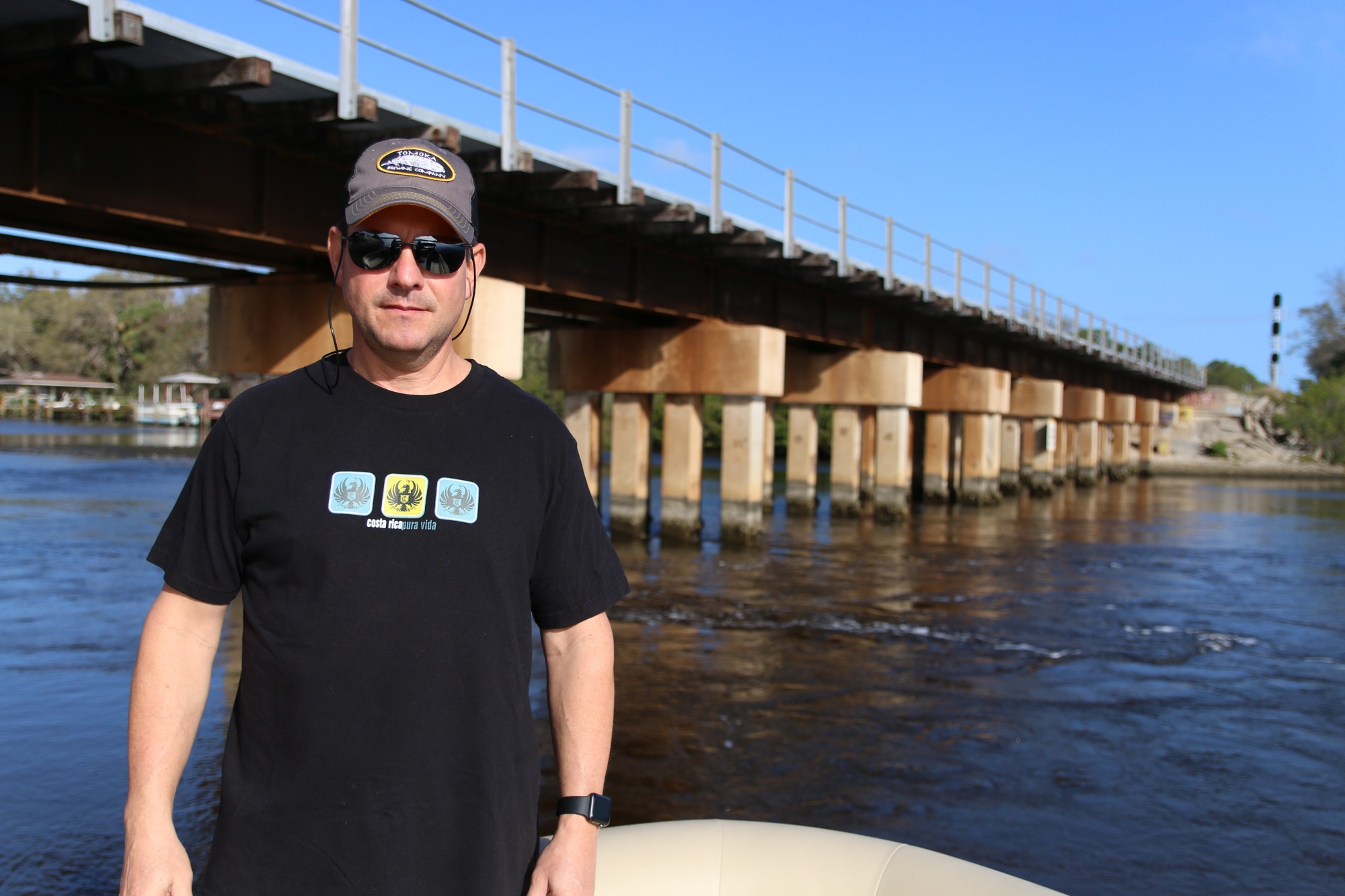 Robert Lloyd on his boat near the Spruce Creek rail trestle. Photo by Nichole Osinski