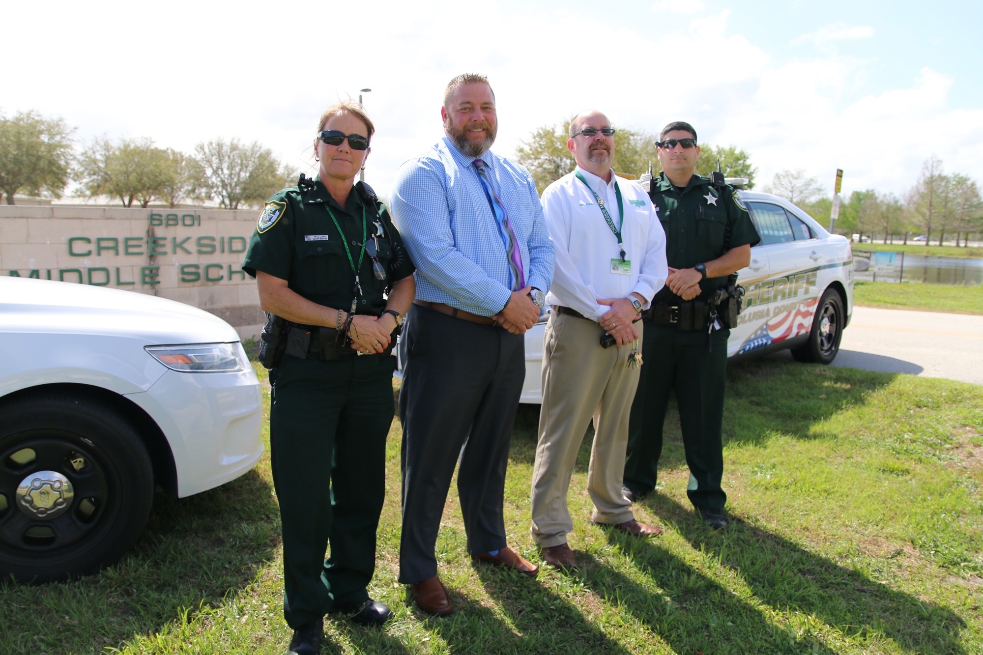 Senior Deputy Jackie Mullins, Creekside Assistant Principal Jay Strother, Principal John Cash and Deputy Justin Lococo. Photo by Nichole Osinski