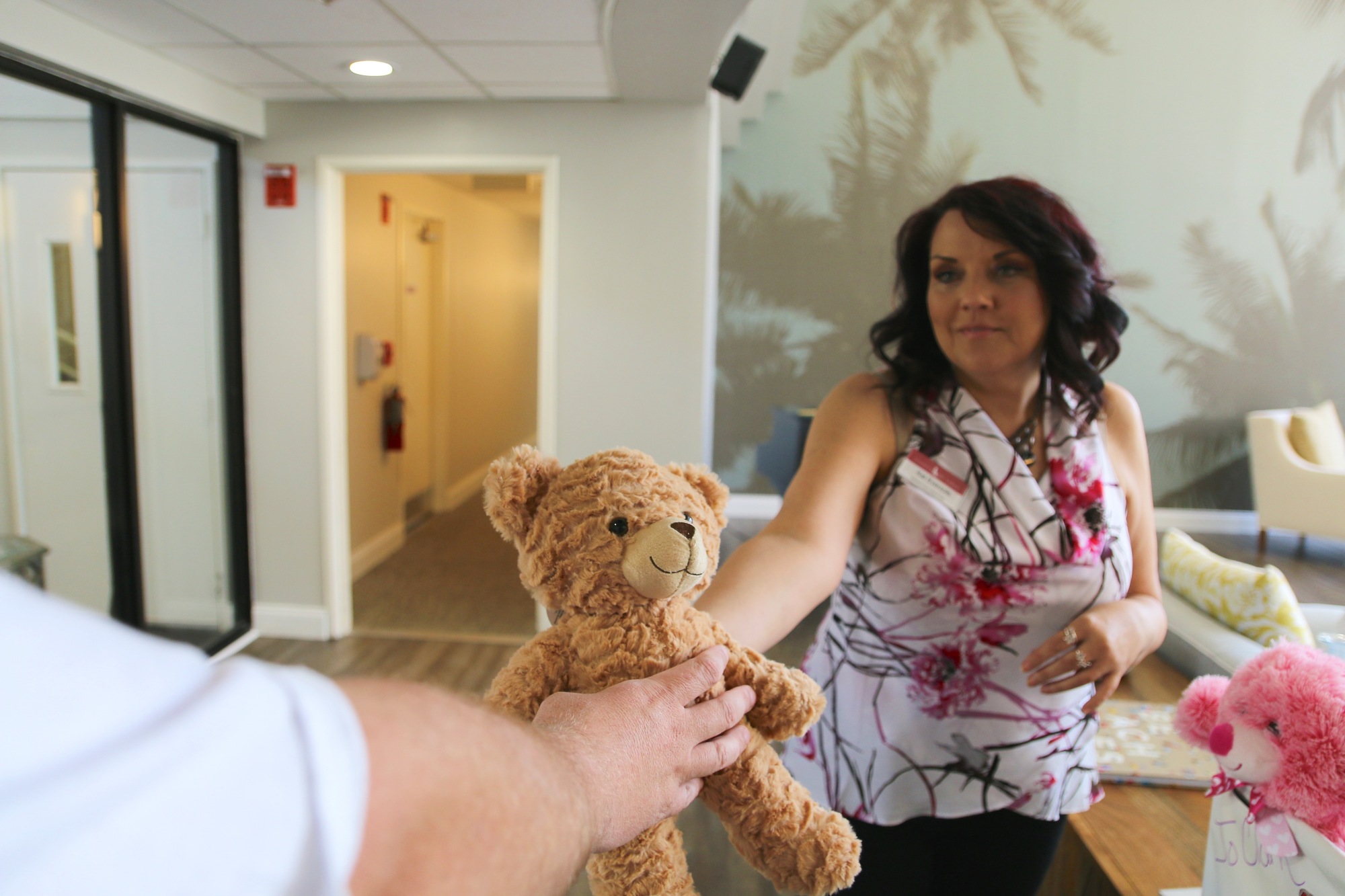 Director of Sales and Marketing Kat Eversole collects a teddy bear. Photo by Nichole Osinski