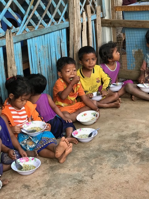 Children enjoying a meal at a graduated village. Photo courtesy of the Port Orange-South Daytona Rotary Club