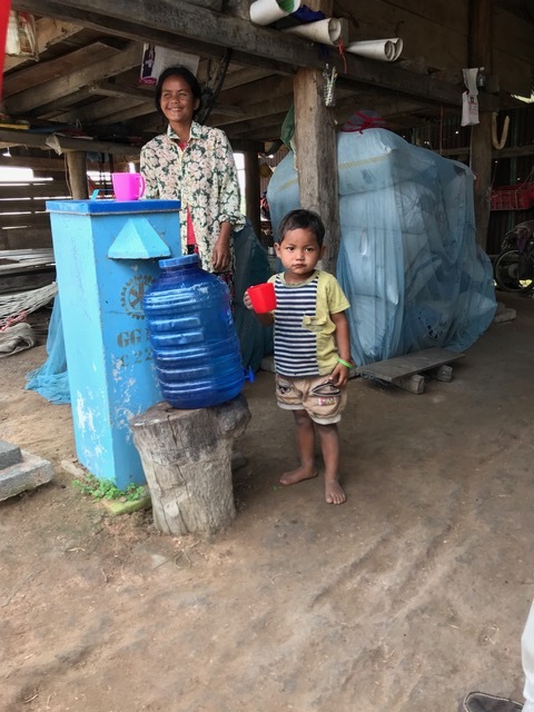 Drinking purified water from the bio-sand filter at a rural home. Photo courtesy of the Port Orange-South Daytona Rotary Club