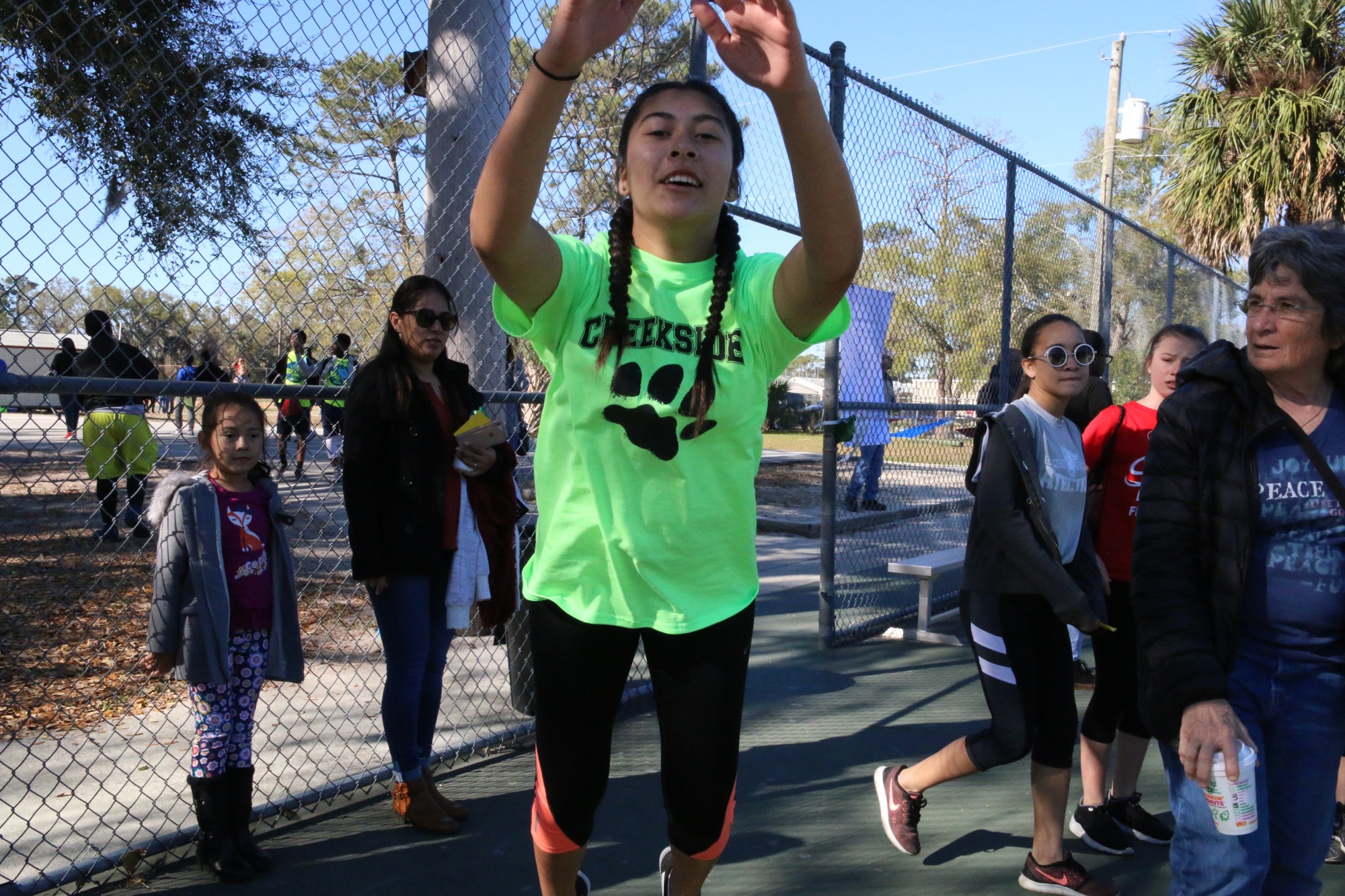 Creekside Middle School student Natalie Cruz practices the long jump. Photo by Nichole Osinski