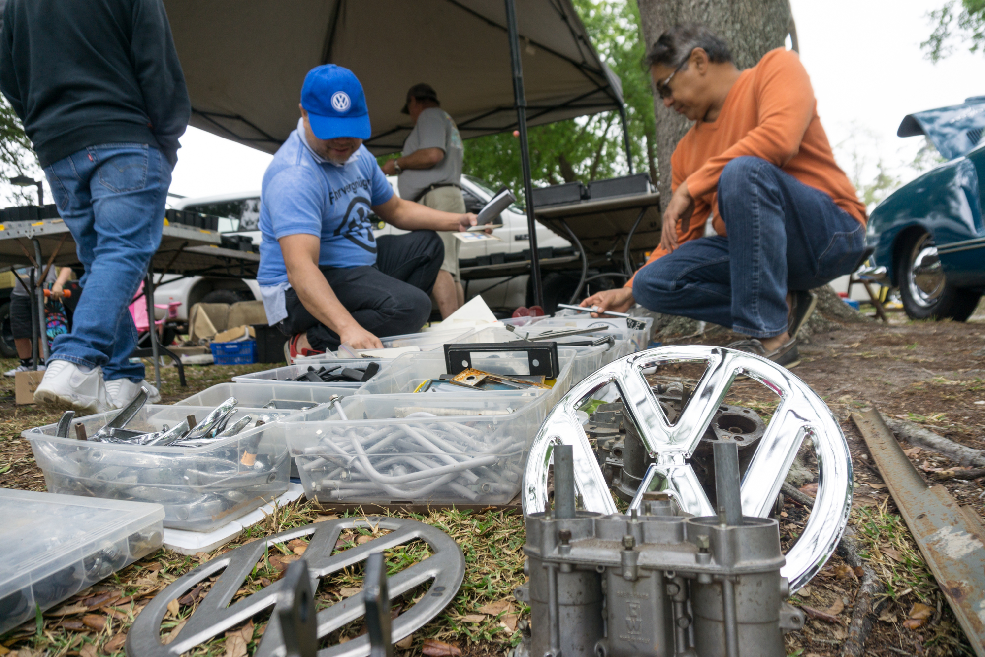 Rainer Ramos and Manny Ensio sift through VW parts sold by local collectors.