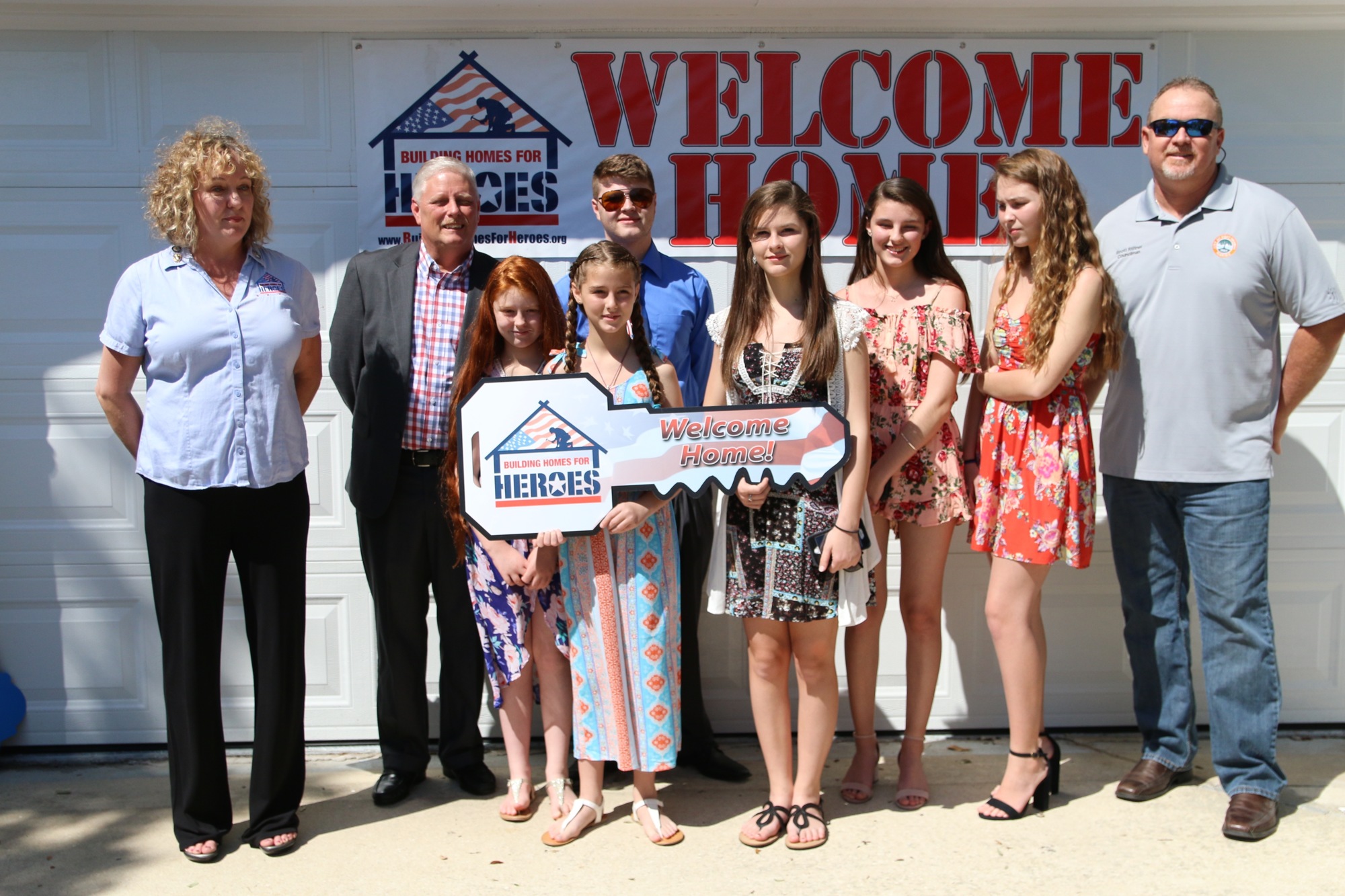 Kim Valdyke, Stephen Pyle, and his children Brandi, Jessie, Steven, Mandy, Michaeli and Chloe Pyle with Vice Mayor Scott Stiltner. Photo by Nichole Osinski