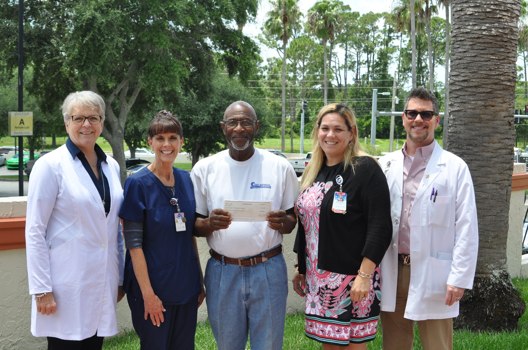 A Halifax Health nursing group donated to God’s Bathhouse of Volusia. Shown are Chief Nursing Officer Catherine Luchsinger; Susie Johnson; Elgia Glass, founder of God’s Bathhouse of Volusia; Nicole Smith; and Dan Elko.    