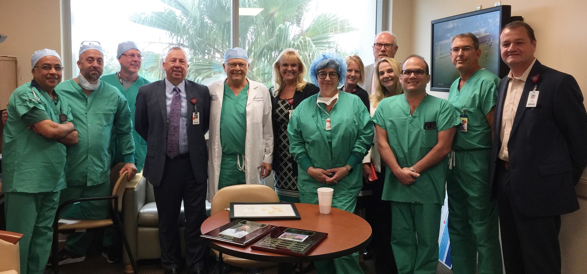 Cardiothoracic surgeon Dr. John Holt (white coat) was recognized as the physician of the quarter for Florida Hospital Memorial Medical Center. He is shown with the cardiovascular operating room team and hospital leadership. Courtesy photo