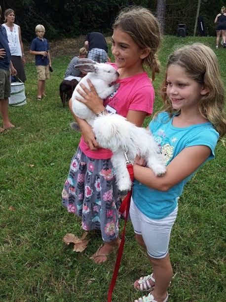 Camryn Chiumento and Bella White wanted their furry friends blessed. 