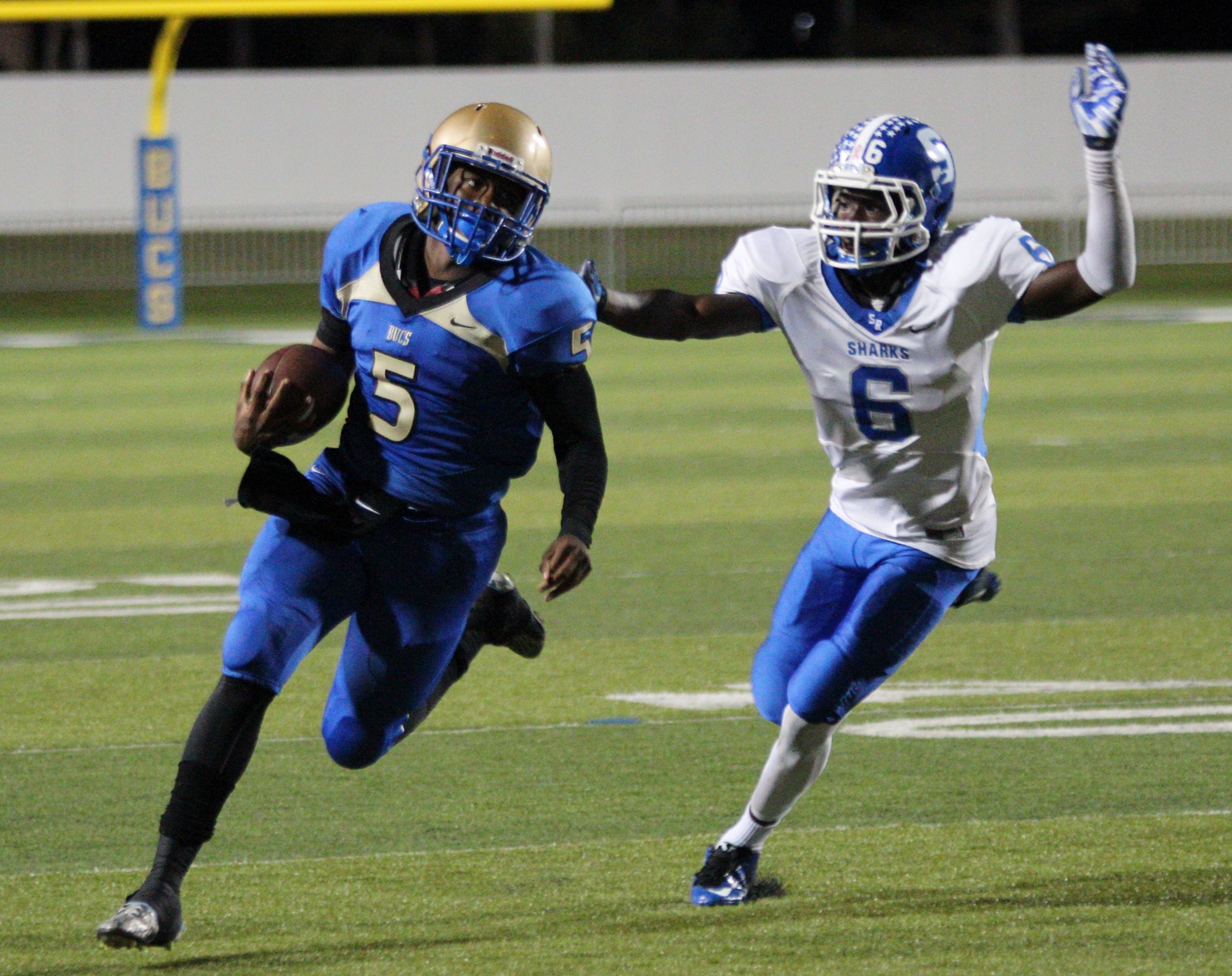 Denzel Houston scrambles for a big gain to set up a Mainland touchdown. Photos by Jeff Dawsey