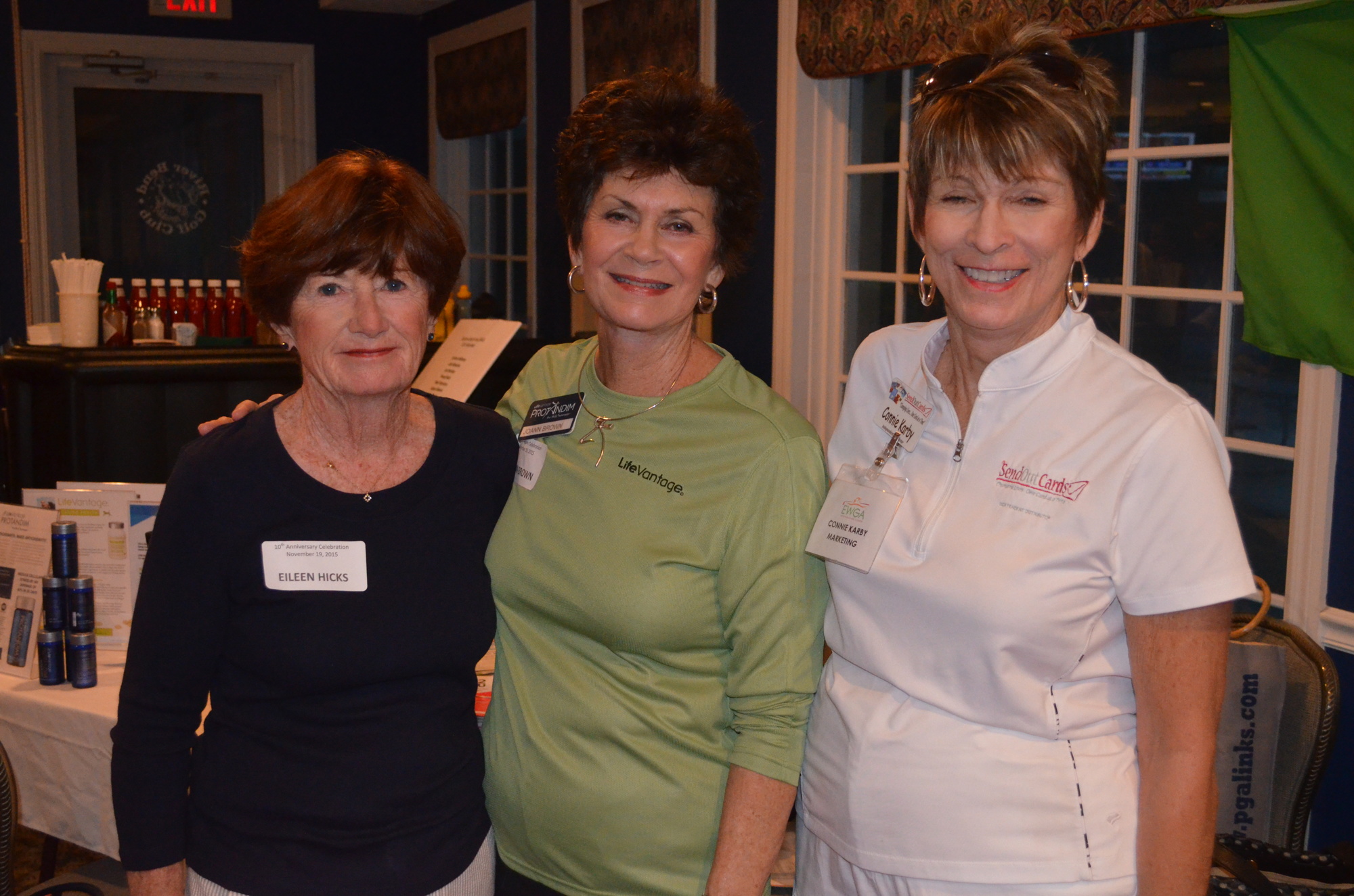 Eileen Hicks, Joann Brown and Connie Karby, communications director, meet at the party.