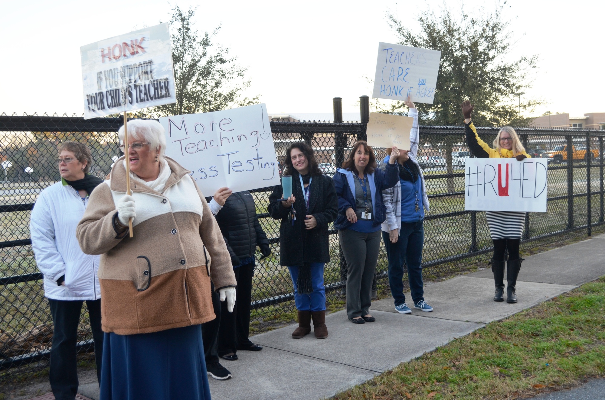 Horns honked outside Holly Hill School on a recent morning as passing drivers showed support to teachers.