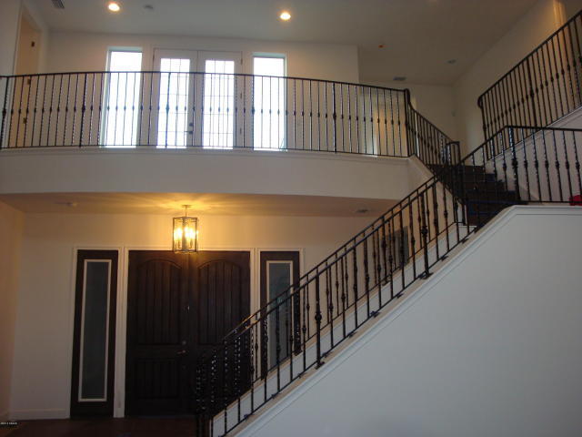 The second floor includes guest bedrooms, game room and owners’ retreat.