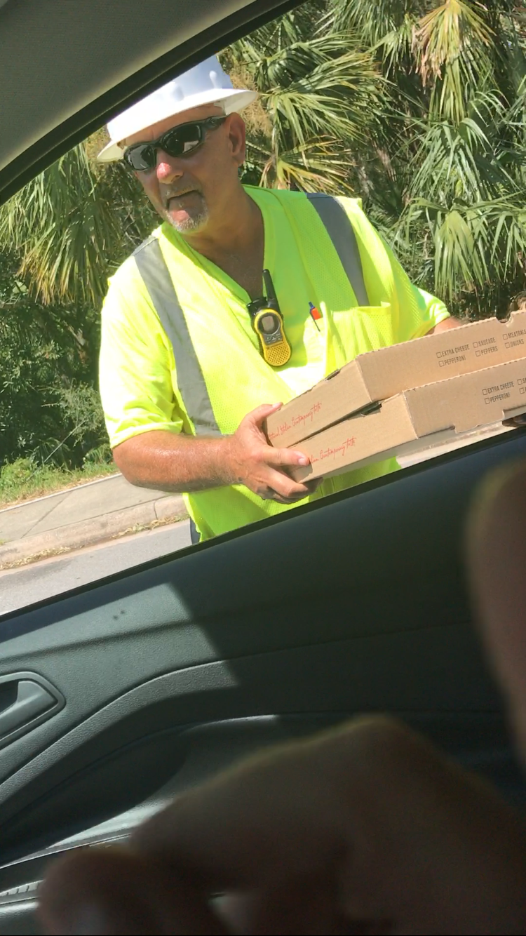 An electrical worker gets a couple of pizzas from Falleta. Photo courtesy Marco Falleta