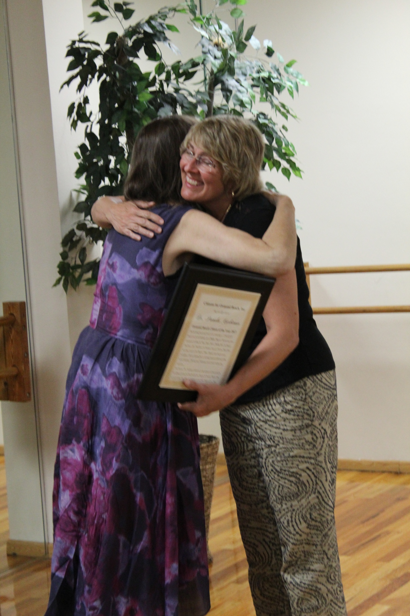 Krista Boehm and Dr. Pamela Carbiener embrace during the Citizens for Ormond Beach's membership dinner on Wednesday, Oct. 11. Photo by Jarleene Almenas