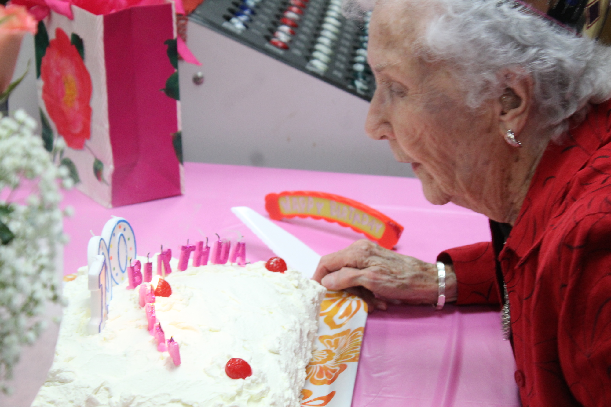 Lillian Johnson blows out her birthday candles. Photo by Jarleene Almenas