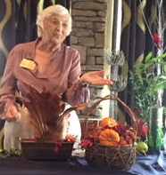 Florida Flower Show Judge Barbara Willy demonstrates holiday floral designs to Tillandsia Garden Club members on Nov. 9 at Stonewood Grill.