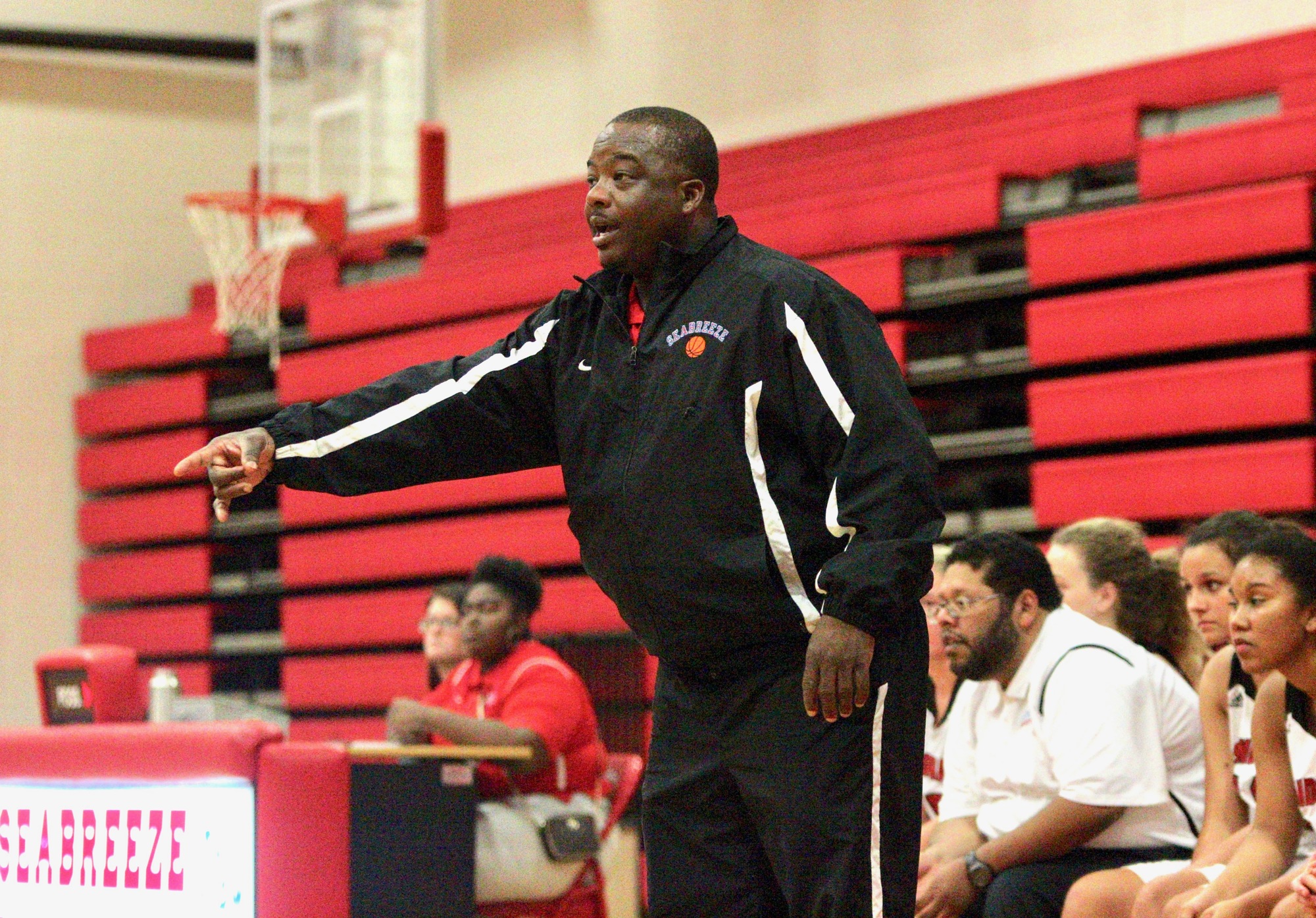 Seabreeze girls basketball coach Avery Randolph gives his team instructions from the bench. Photo by Ray Boone