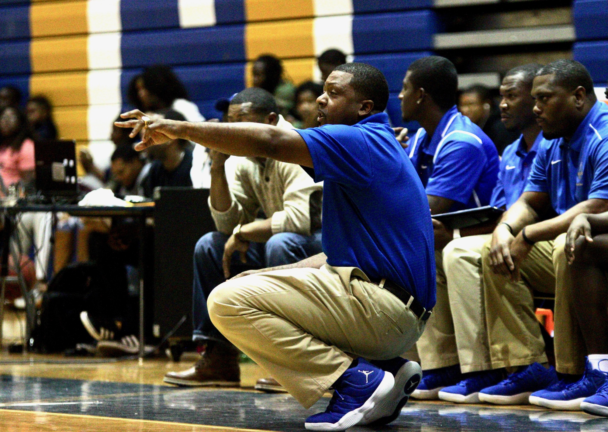 Mainland coach Joe Giddens shouts instructions to his team from the bench. Photo by Ray Boone