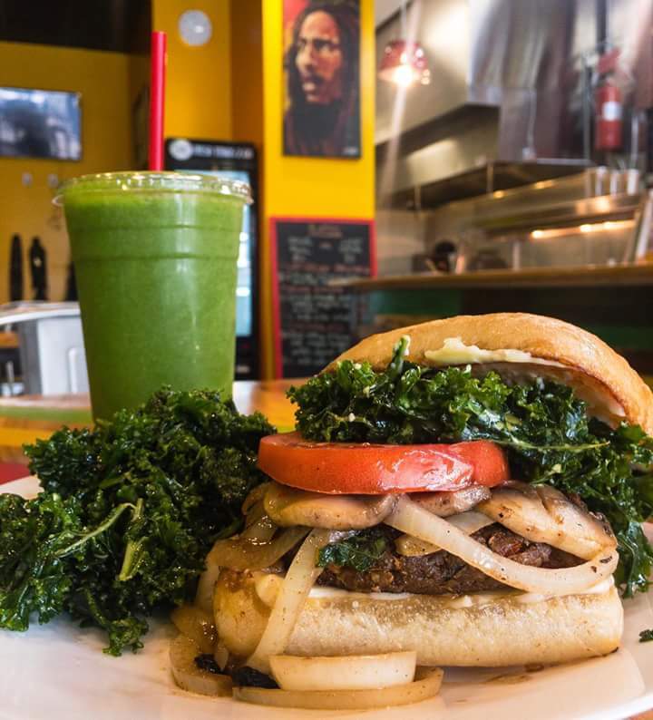 Organic veggie burger, made with pan-seared mushrooms and onion piled on top of a veggie burger with sliced tomato and our seasoned kale.  Photo courtesy of Camille Holder-Brown
