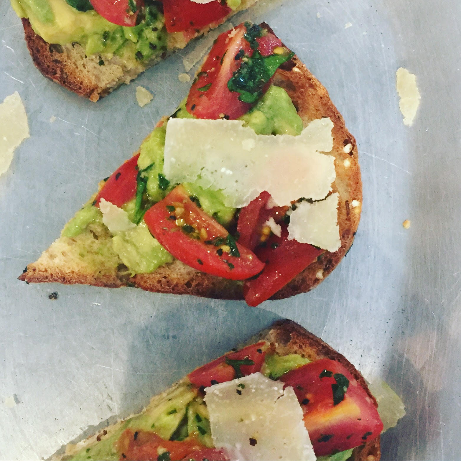 Avo toast, made with multi-grain toasted bread with freshly smashed avocado, marinated tomatoes and freshly-shaved parmesan. Photo courtesy of Haley Kirk