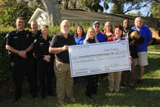 OBPD, OBPAL and Tomoka Travelers RV club members as it presents the check to OBPAL. Photo courtesy of Rick Sandora