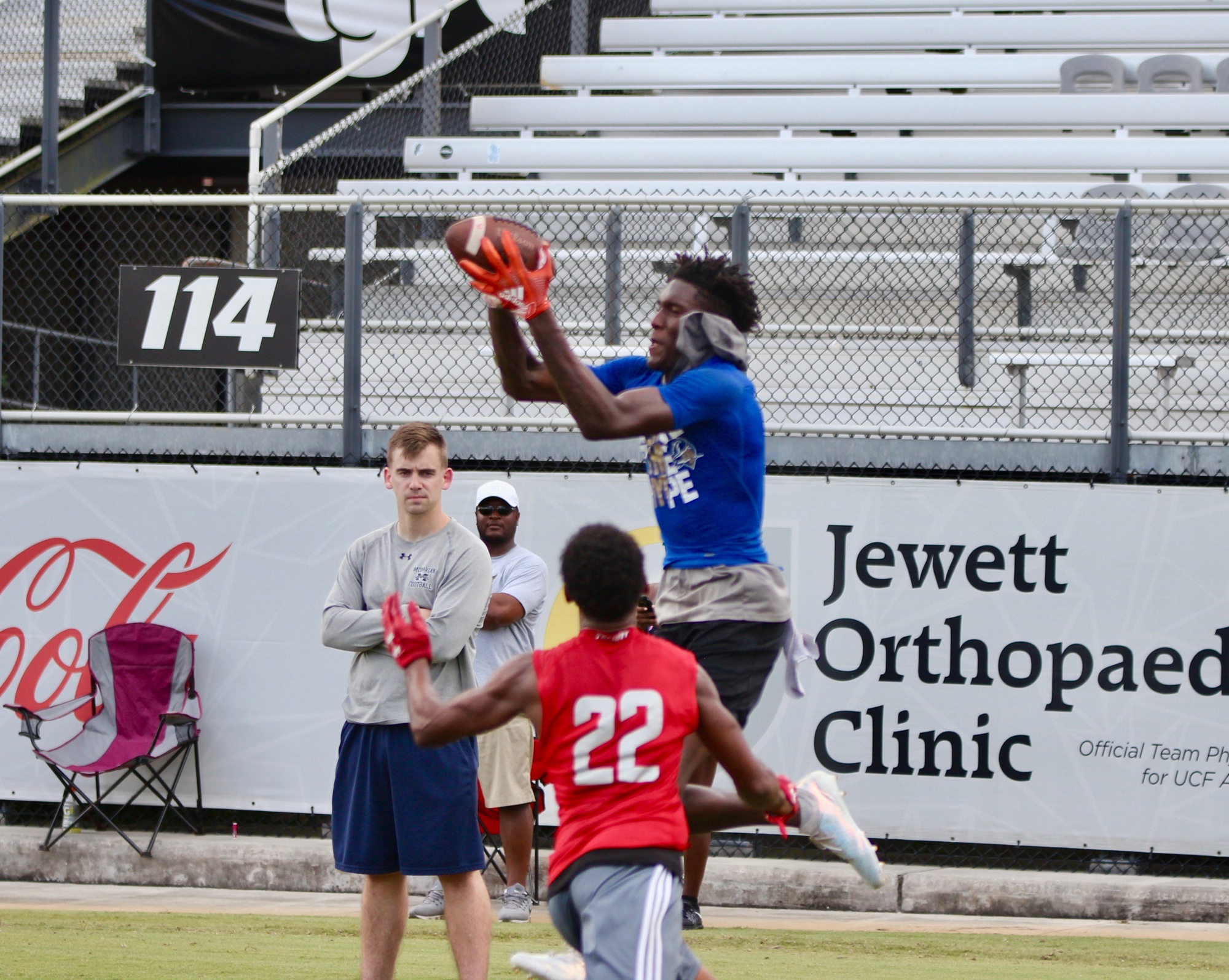 Andrew Plummer makes a catch over a defender at UCF's 7-on-7 camp on June 16. Photo by Ray Boone