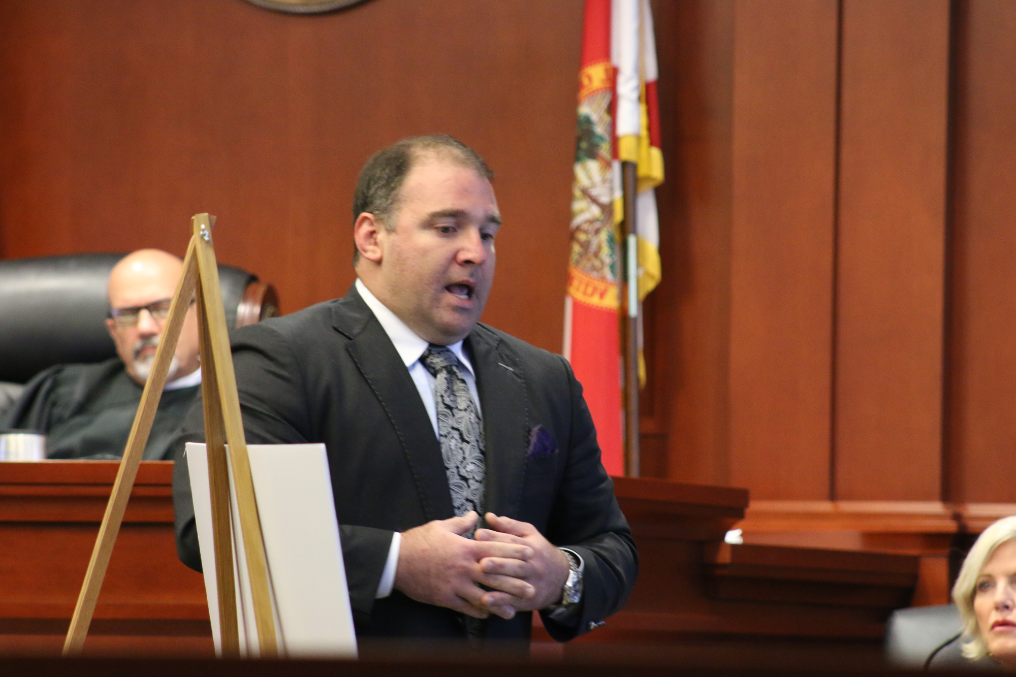 Attorney and Daytona Beach City Commissioner Aaron Delgado  conducts the opening statements on behalf of James and Dale Holcombe for their trial. Photo by Jarleene Almenas