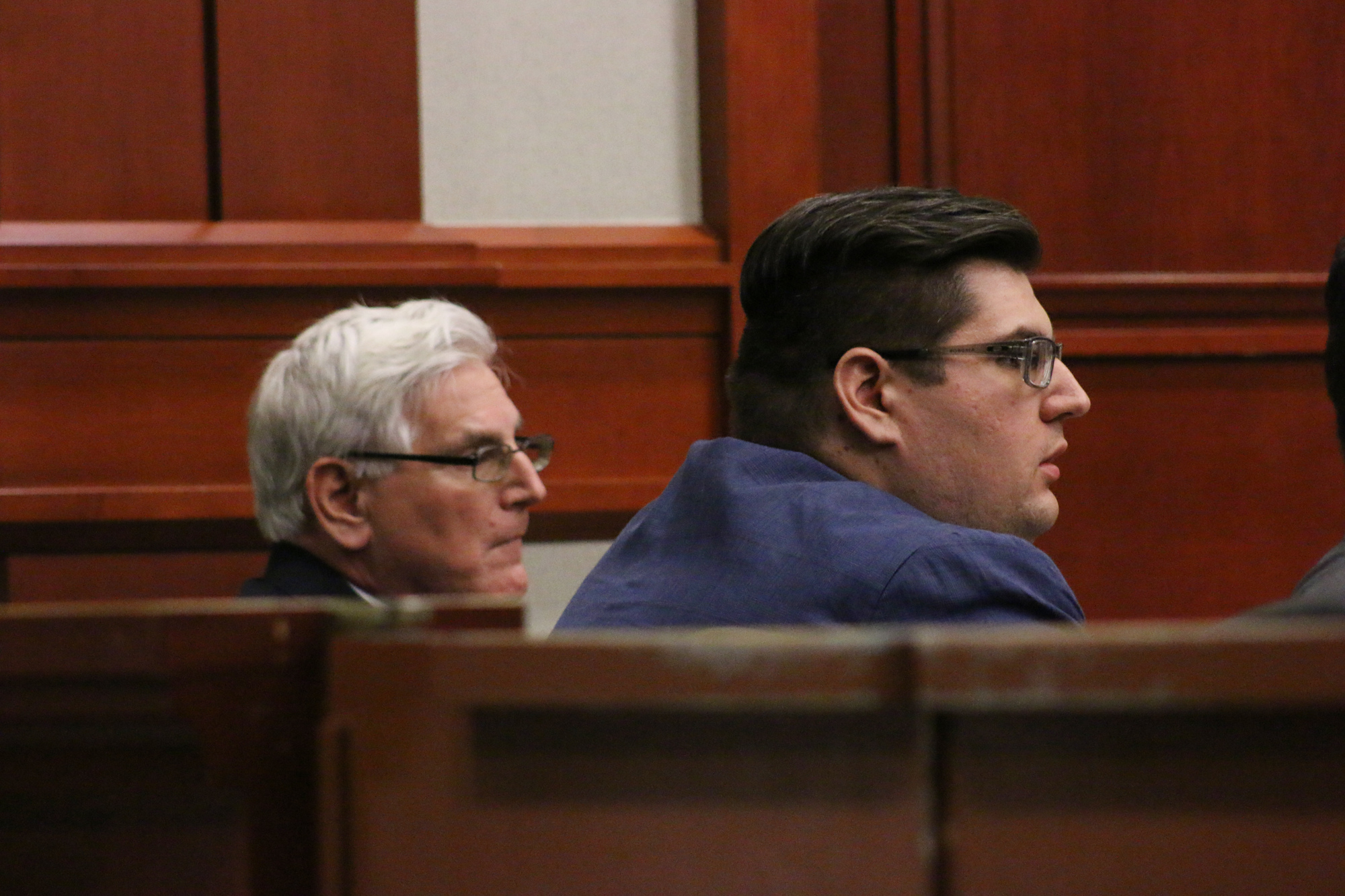 Dale Holcombe and James Holcombe listen as their verdict is read.