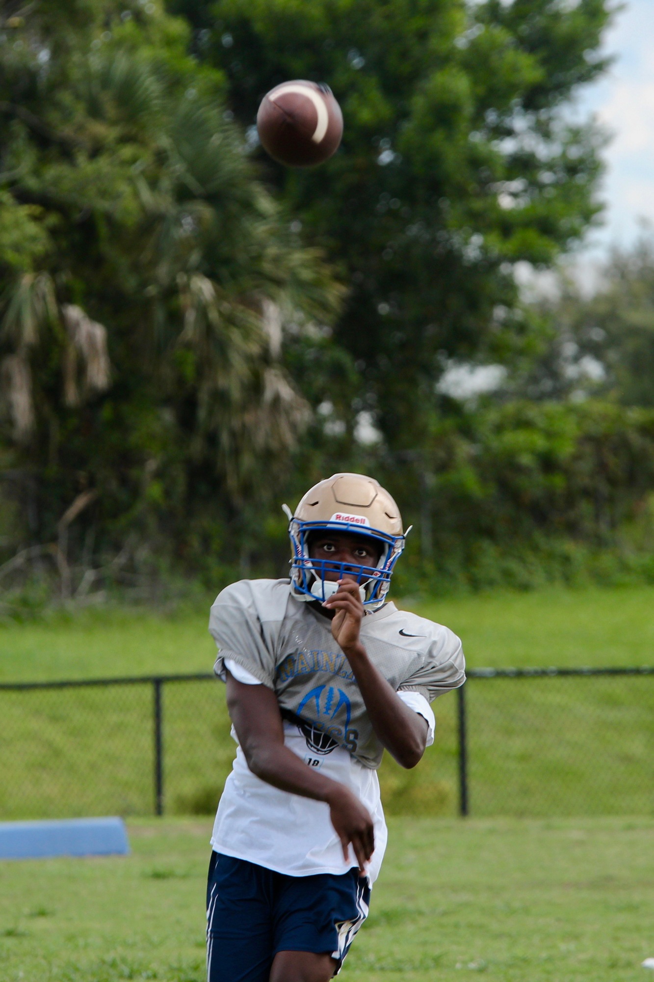 Mainland quarterback Taron Keith throws a ball at practice. Photo by Ray Boone