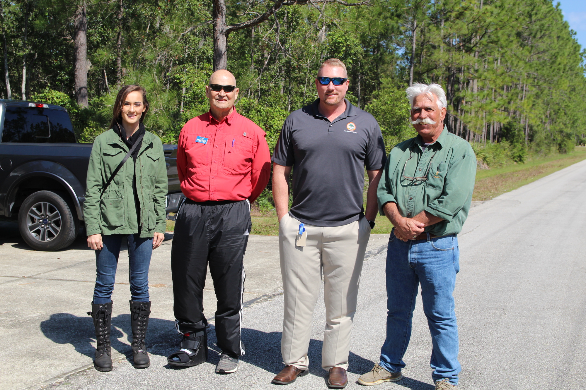 Savannah Weaver, Lee Barreiro, Reclaimed water production manager, Steve Parnell, and Paul Rozar at the solar panel site. Photo by Tanya Russo