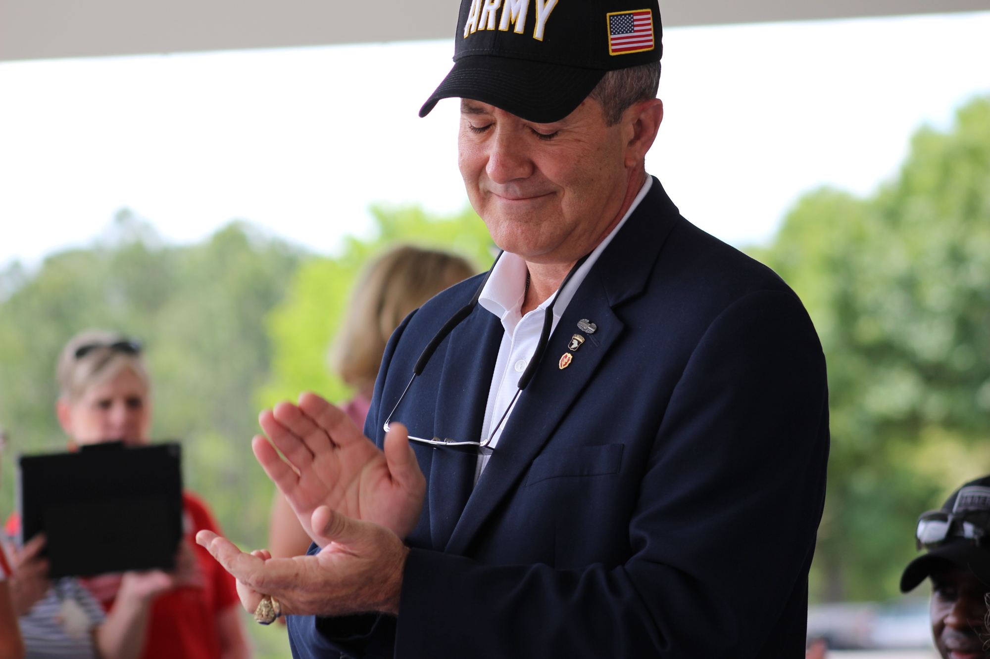 Guest Speaker and retired Brig. Gen. Ernest C. Audino, U.S. Army, gives the quilters and veterans a round of applause at the first-annual QOV Golf Tournament on Saturday, March 30. Photo by Alyssa Warner