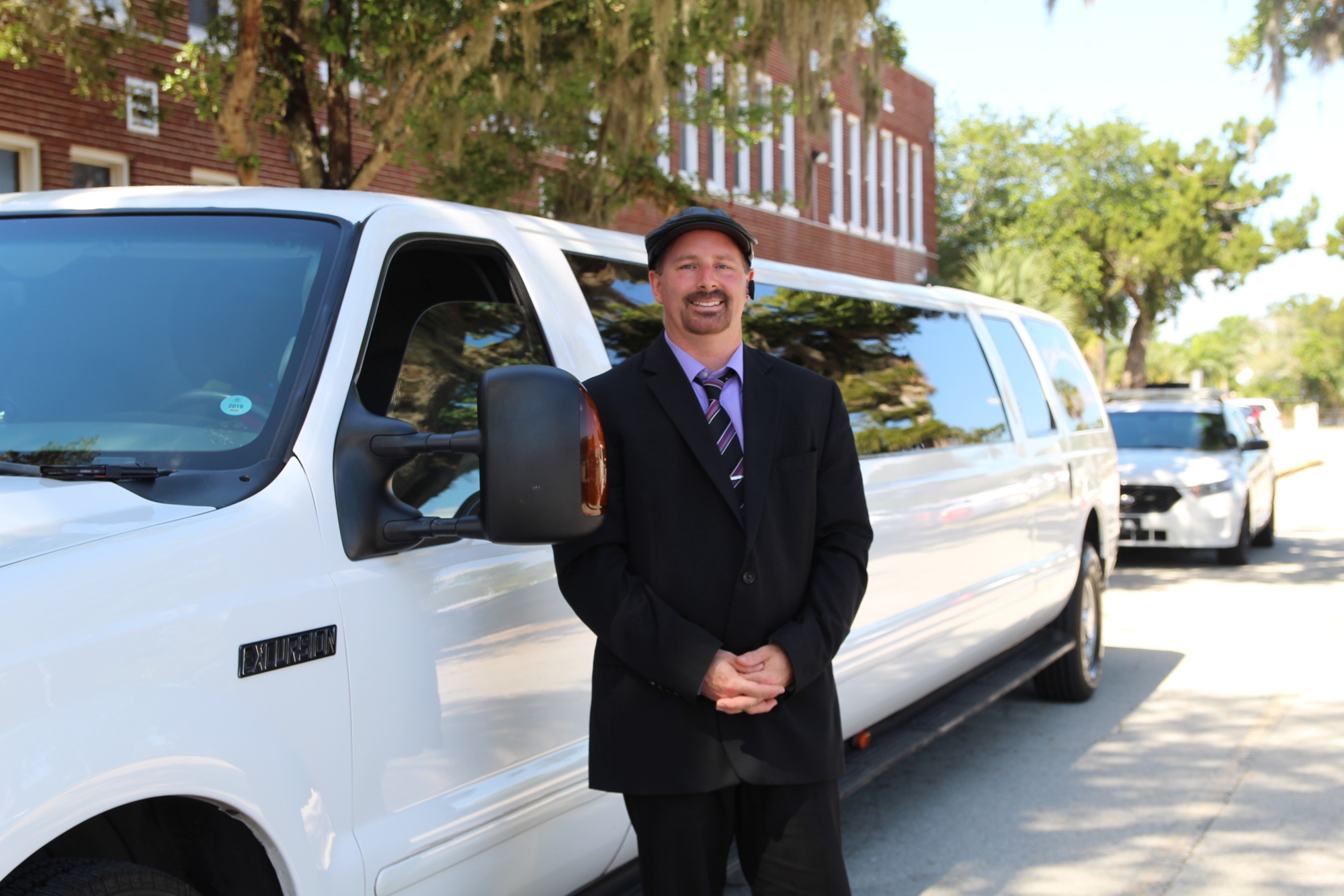 Elegant Limousines driver, Mike Denning, waiting to take students to Chuck E Cheese. Photo by Tanya Russo