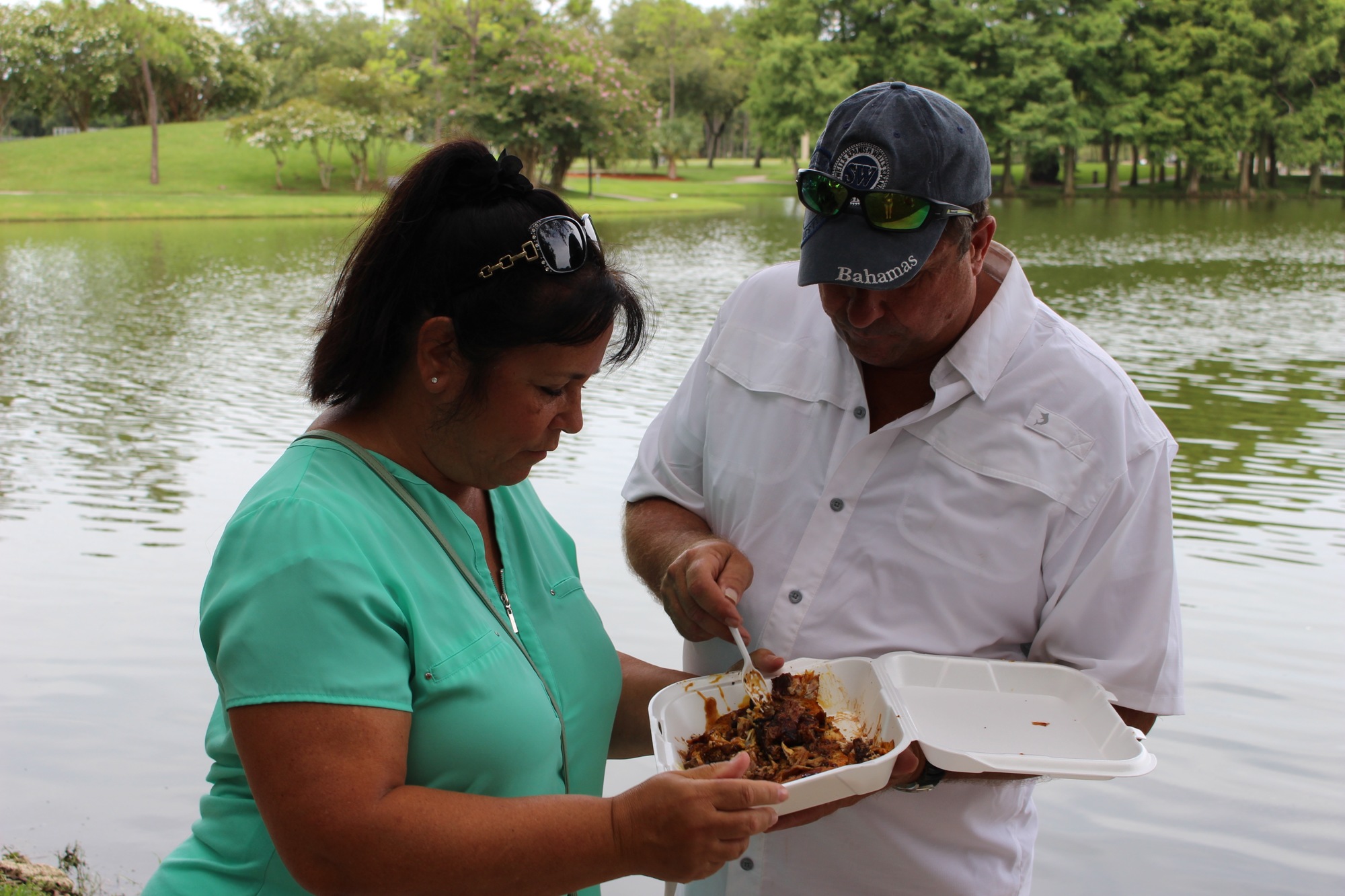 Anita Soto Parker and John Parker enjoyed the Conch Salad and Jerk Chicken from The Conch Dynasty food truck at the Fourth-Annual Crab and Seafood Festival on Saturday, July 13. Photo by Alyssa Warner