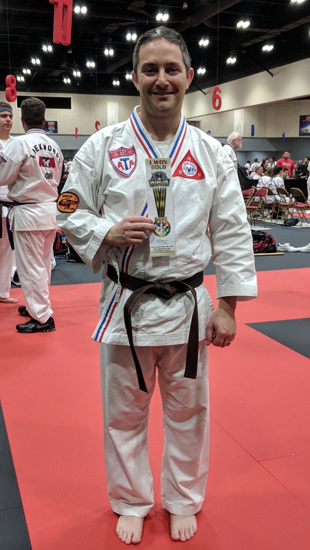 Assistant City Manager, Alan Rosen, shows his first place ribbon in forms at the A Songahm Taekwondo World Expo in Little Rock. Courtesy photo