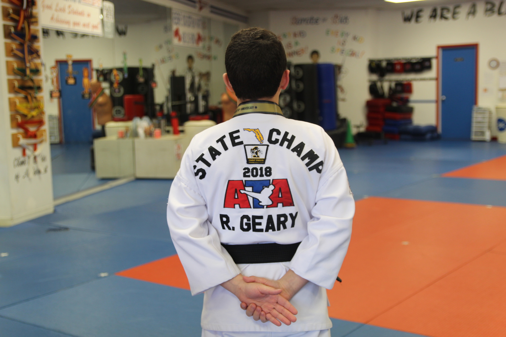Ryan Geary shows his special uniform that reflects his 2018 state championship title in A Songahm Taekwondo. Photo by Tanya Russo 